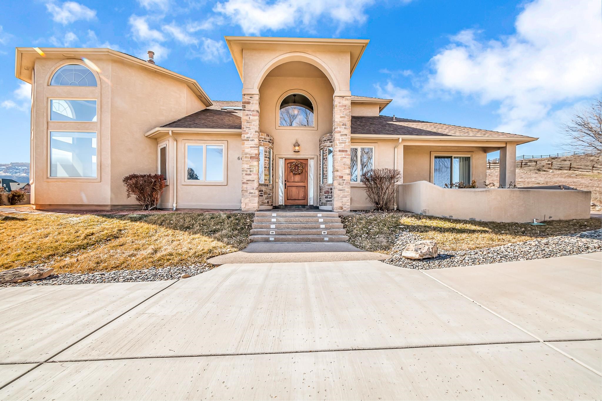 Discover the ultimate in luxury living! Custom built with meticulous details and uncompromising quality, this executive home offers amazing views and a low maintenance lot. With over 4000 square feet, inside you'll find a gourmet kitchen with granite counters, Jenn-Air appliances, and a huge butler's pantry. You'll adore the 2 story living room with floor to ceiling windows with tons of natural light and fireplace. Upstairs via a stunning spiral staircase you’ll find a family room with balcony along with a guest suite. Don't miss the main floor primary suite featuring a gas fireplace, large soaker tub, and tons of closet space. In addition, bedrooms feature their own private patios and are generous in size. You’ll also find a large executive office and a massive laundry room with built in desk perfect for crafting and hobbies. This home has too much to offer, you must experience the beauty and uniqueness of it today.
