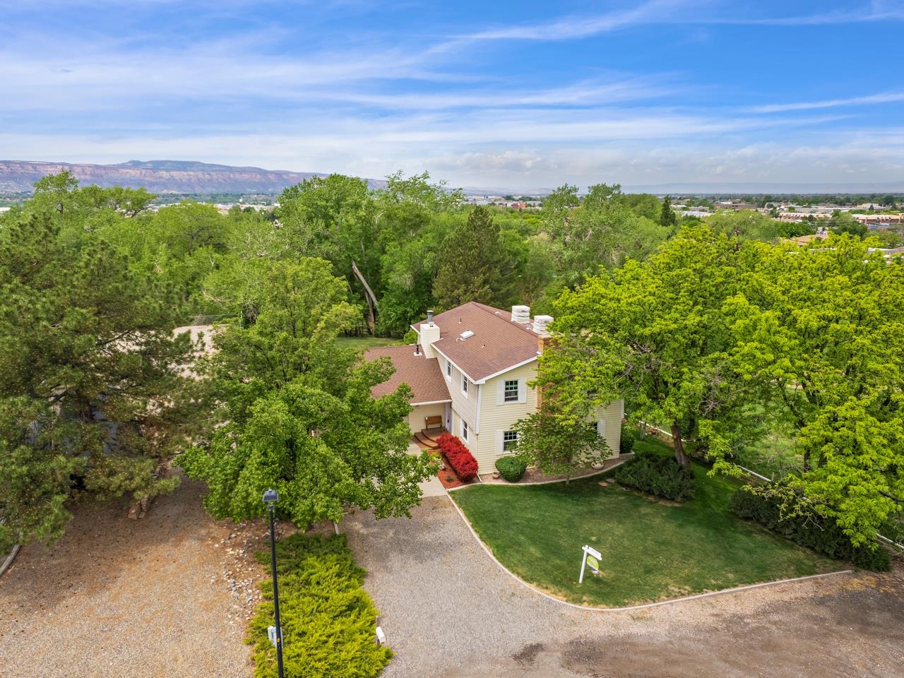 Do not miss out on this opportunity in the heart of Grand Junction, CO! This incredible home has been pre-inspected and has gone through an appraisal with Alpine Bank in September of 2022 where it appraised for $875,000.  Everything you could ask for is right here: large open living spaces, beautiful kitchen, large bedrooms, storage, a walk-out basement, amazing views & numerous windows, large garage & outstanding yard space. The whole home has been pre-inspected and went through an appraisal with Alpine Bank in September of 2022 where it appraised for $875,000. The main level has a large living room w/ a gas fireplace, built in storage, & lots of natural light, a formal dining area with incredible views of the Bookcliffs & Mt Garfield, & a kitchen with plenty of storage, stainless appliances, eat-in island & opens up to the screened in deck w/ room for additional dining & sitting area. The laundry room, a butler's pantry/mudroom & half bath can also be found on this level. Upstairs find the huge primary suite w/ a 4-piece, 3/4 bath, dual walk-in closets & room for a sitting area. Down the hall are 2 additional large bedrooms, a full, 4-piece bath & more storage closets. The basement is bright & welcoming w/ a walk-out, covered patio. This level features two additional living areas (one is currently an office/art studio), storage room (currently a gym) & sleeping nook/4th bedroom (non-conforming). This home has managed to uniquely balance original vintage features w/ many modern updates to give you the best of both worlds. But the star of the show is the unbelievable lot that it is built on! Sitting on nearly an acre, this home has wonderfully landscaped yards, the backyard being fully fenced w/ apple trees, pear trees, a cherry tree, an additional open sitting area, views across the Grand Valley & plenty of trees for shade. Particularly special is that across the canal service road is the back half of the lot, which is fully fenced, wooded & natural - your own personal forest! Here is a plethora of wildlife, a quiet place to stroll or keep small livestock, a shed (that stays) & more views at the back fence. The overall location of this personal paradise is just down the road from schools, parks, shopping, dining, St Mary's Hospital, CMU, and just a short drive to downtown GJ. Do not miss out on this fantastic opportunity to live and play in Grand Junction, CO!