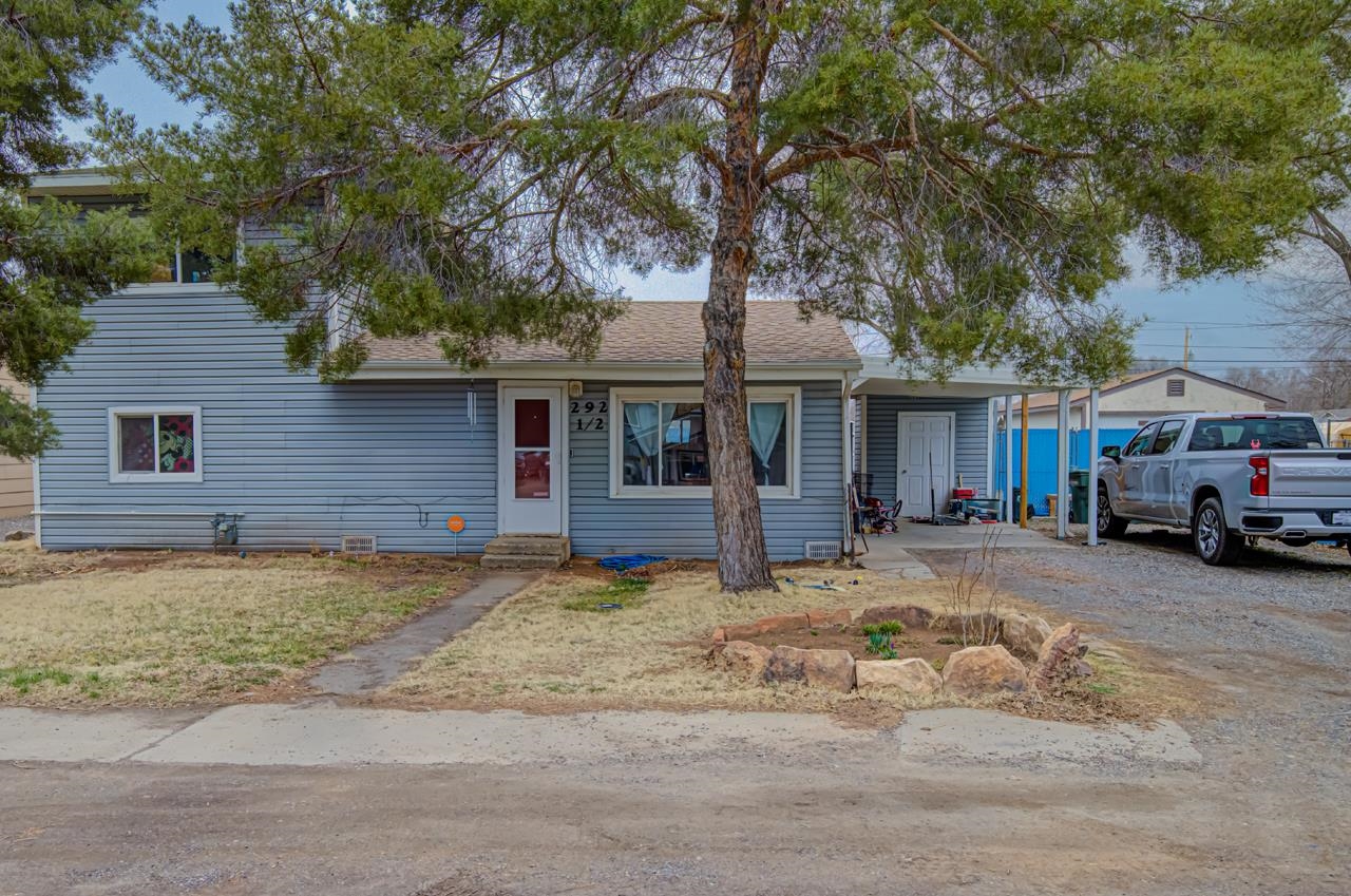 This charming, 3 bed 2 bath home is located on a quiet street in Orchard Mesa. New carpet in 2 rooms, plus stairs and new vinyl flooring throughout the home, plus fresh coat of painting throughout the home. Don't forget to check out the kitchen with the updated cabinets and countertops. Need space and RV parking?  This adorable home includes a very large backyard and plenty of RV parking with shed for extra storage. Primary room is very private, with being the only room upstairs PLUS private deck overlooking the backyard. This home is calling your name, don't wait!