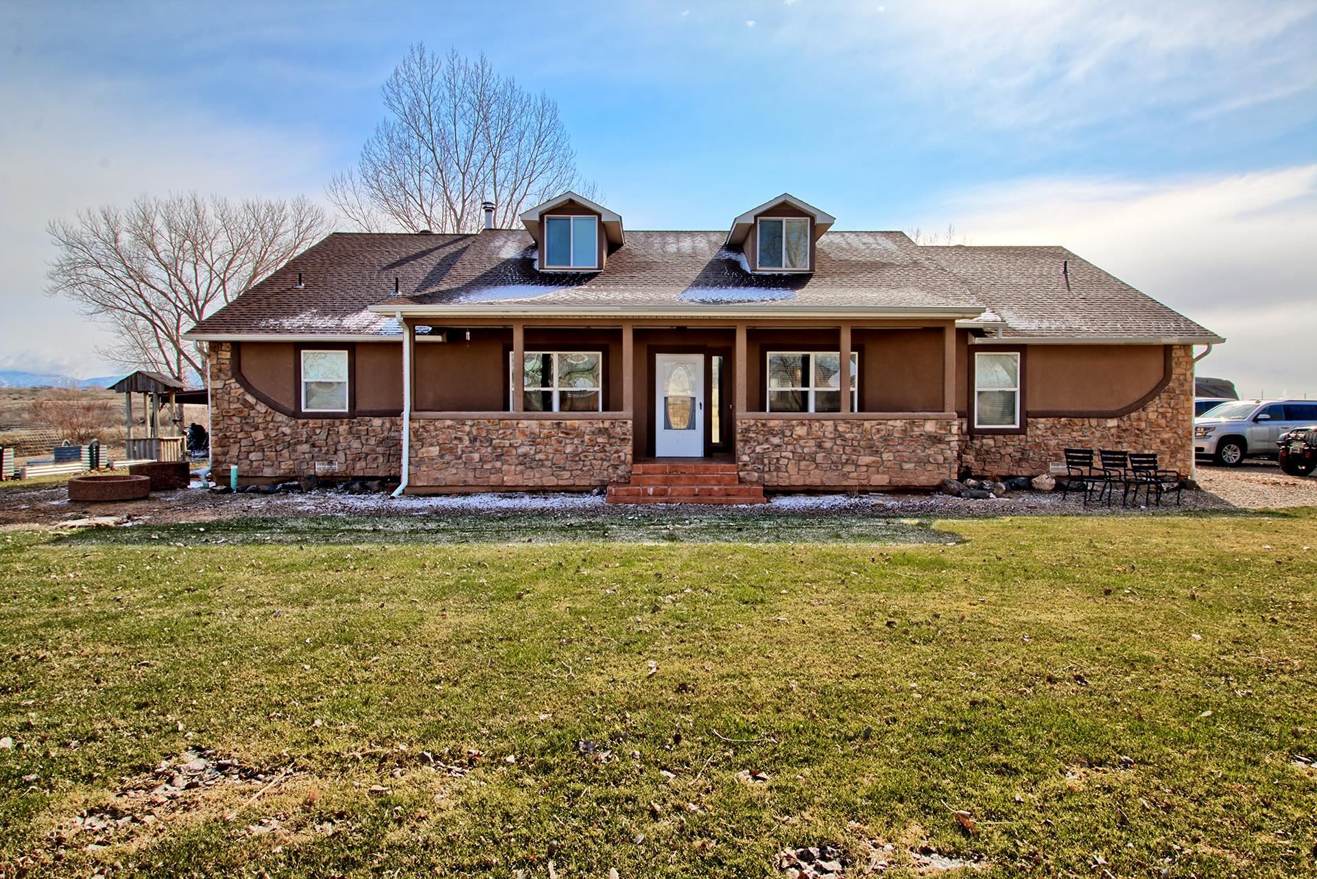 Total sq. footage and bed/bath count of are the two homes combined. Looking for a home and income? Need a Mother-in-law setup? Always wanted some land, irrigation water and a big shop????? This property is what you are looking for! Main home is 2796 sq. ft., 3 bedrooms + office, 4 baths, family + living room and 3 car attached garage-WOW! Then you have the detached 1200 sq. ft. 3 bedroom, 2 bath, 3 car attached garage. Sellers have the detached home set up as an Airbnb, comes fully furnished and has bookings through November 2023.  (Income will be provided for interested parties and will help with the transition) Don't want an Airbnb, not a problem, reservations can be canceled. 60x40 shop built in 2015 with room for everything you have and everything you want! 3 sheds/outbuildings, 9.70 acres, 5 shares of Loma Lateral Irrigation water, plenty of room for trucks, toys and animals. Easy access to Hwy 6&50 and I-70. Home Warranty provided on BOTH homes!