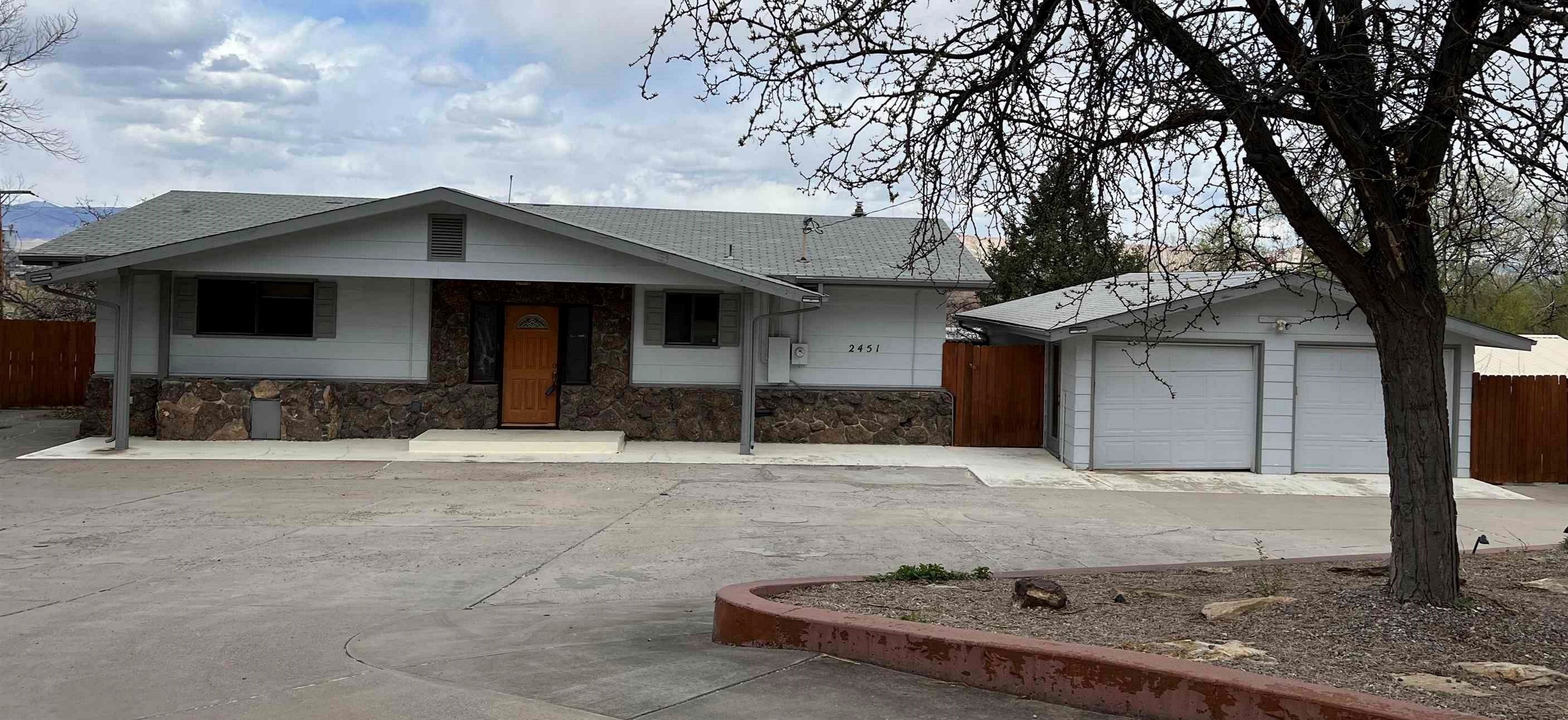 Centrally located, Redlands home on .44 acres, with private circle drive, mature trees and no HOA.  Spacious ranch style with full walk-out basement, detached garage and two workshops/sheds.  Nice views of the Bookcliffs outside of your floor to ceiling windows in the main living room as well as your wrap around deck.  Large family room in the basement features outdoor access to built-in BBQ as well as a gas fireplace. Solid hardwood doors and plenty of storage.  New carpet, paint and laminate flooring installed in 2022.