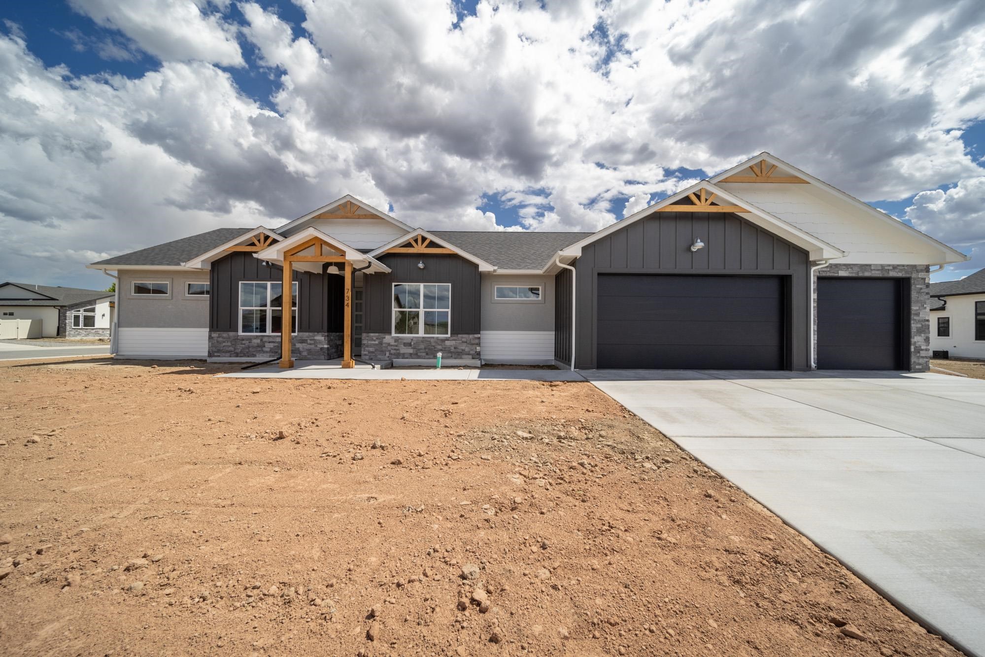 NEW CONSTRUCTION by TreyTyn Homes in Orchard Ridge; Fruita's premiere subdivision for high-end & unique builds! This stately home features an open + brights floor plan with amazing Builder upgrades throughout! As you enter the charming front door, encased by rough sawn grand entrance, you have immediate access in to the office/4th bedroom, for convenience or private guests stays. Cluster bedrooms on the east side of the home. 2nd & 3rd bedroom both have their own walk-in closets and access to the full bathroom with upgraded cabinet vanity, tub/shower combo with tile surround and quartz countertops. Primary bedroom is privately located on the south side of the home and features a gigantic walk-in closet with built in shelving, walk-in shower with modern tile accent, dual vanities with quartz counters and pass-through access into the laundry room, for added convenience! Open living + kitchen area with cozy electric fireplace for added ambiance and a chef's preferred kitchen with upgraded cabinetry, white picket backsplash, quartz countertops and a hidden-access pantry offering abundant built-in cabinetry and open shelving! Additional mud room area offers built-in locker cabinets for EVEN MORE storage option and powder room/half bath for convenience right off the garage. Oversized 3-car garage is deep enough for your trucks + toys! RV parking space and a large 0.20-acre corner lot with magnificent north-facing views! Close to Downtown Fruita's growing and thriving community, with fabulous dining options, unique niche shopping and just a short distance to all the hiking + biking trails Fruita is known for! Call this place HOME today!