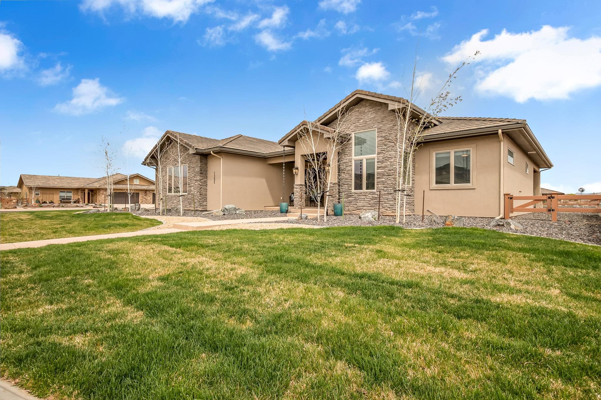 Step into a luxurious, custom built home with open concept living shouting ENTERTAINMENT!  Impress all of your guests with the unique touches this home shows throughout. Enjoy the flow of the great room when moving to the covered outdoor patio offering tremendous views of the Book Cliffs and the Grand Mesa.  Warm by the gas fire pit that has a tee split installed for a gas grill!   Guests will enjoy the privacy with the Jack and Jill bath and split floor plan that includes an office.  This desirable home is nestled around the park at Adobe Creek and is within golf cart distance to Adobe Golf Course, in Fruita, Colorado.