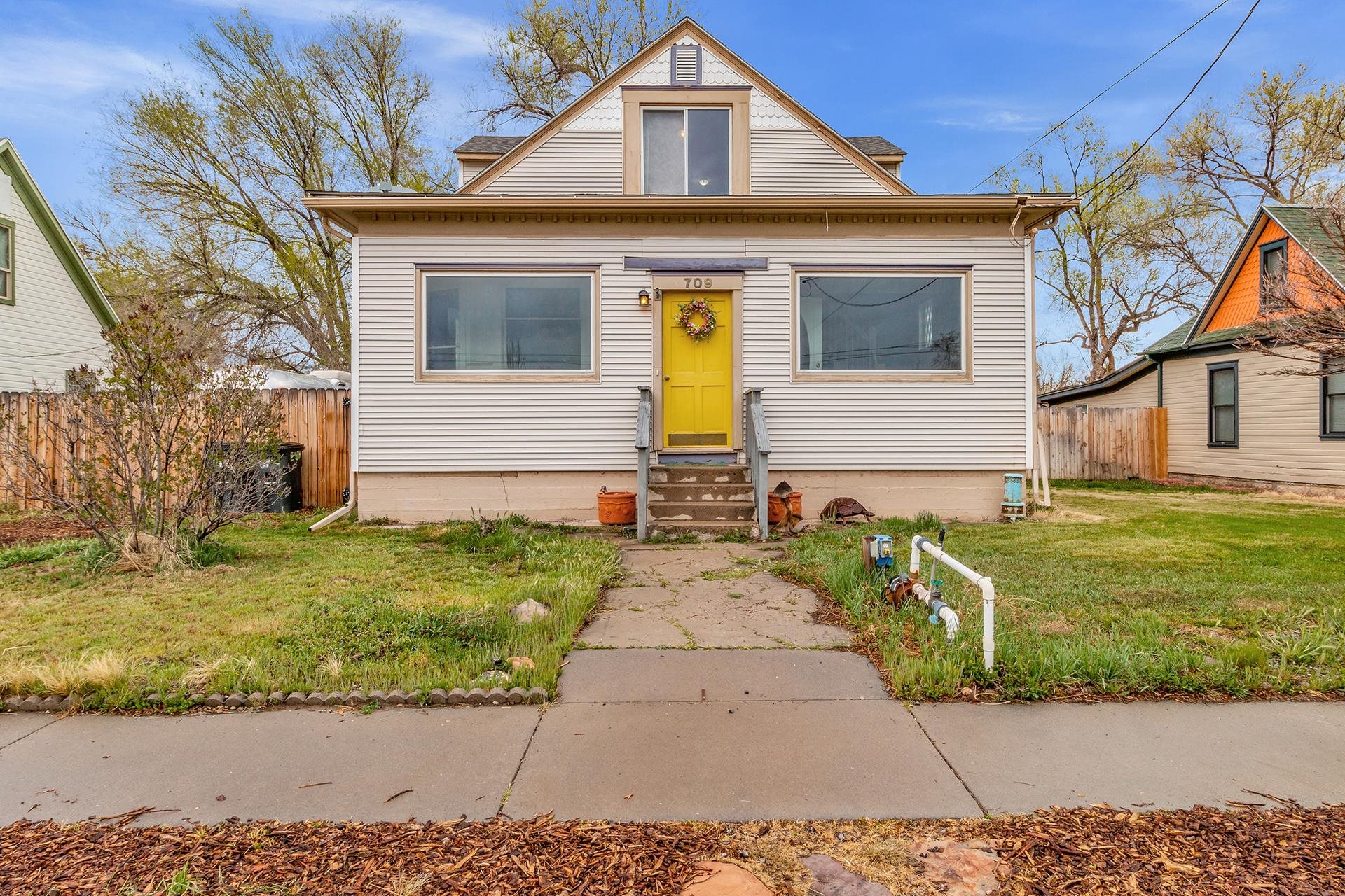 Downtown Fruita home that is full of character and charm! Enjoy walking to concerts, restaurants and shopping from this 4-bedroom 3-bathroom home situated on a large .34-acre lot. The main floor has multiple inviting rooms and spaces, including the primary bedroom, kitchen, breakfast nook, living room, sitting area, dining room and entryway. Upstairs you'll find the family room, three additional bedrooms and a bathroom. The spacious backyard has mature landscaping, large deck, two exterior sheds, RV parking and space to build a future garage. Don't worry about storage because this home has a full unfinished basement with an exterior entrance. With plenty of space and no HOA, this could be the one for you!