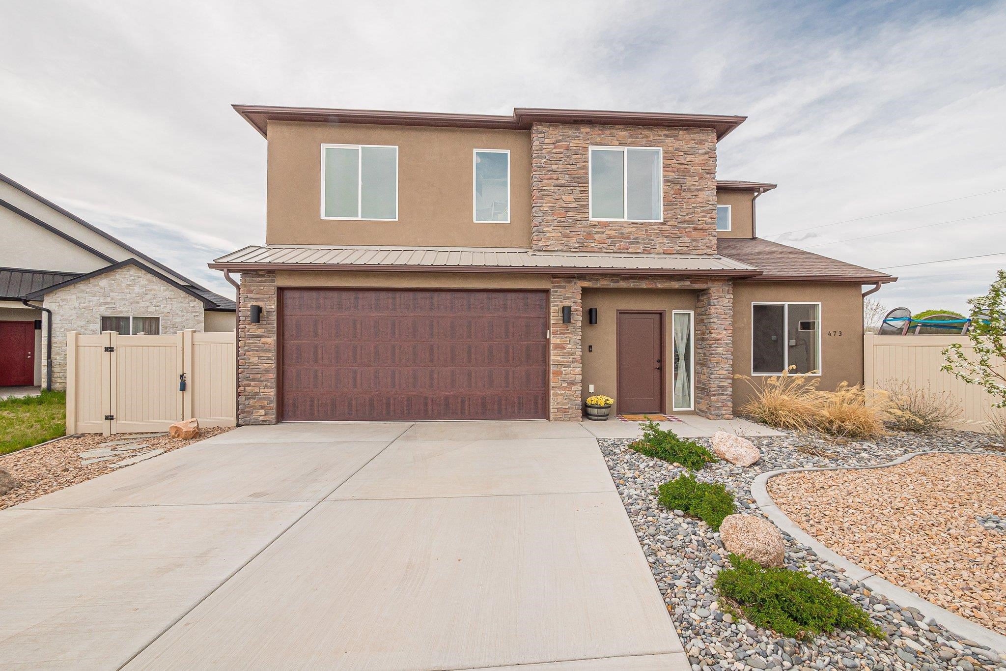 Ready, set, go!! This one’s not going to last!! Beautiful stucco 2-story home with 2043 square feet, 4-bedroom, and 3-bathroom, is nicely situated on a large, completely fenced in cul-de-sec lot. The open concept floor plan is elegantly accentuated by the grand windows and vaulted ceilings, providing an awe-inspiring light and bright living area. The large dining/kitchen combo lead to the backyard where the patio and pergola provide ample seating for endless outdoor activities, making this home perfect for entertaining family and friends. The landscaped back yard with sprinkler system and irrigation encompasses RV parking with double gates for easy access. City close and country feel, this home provides easy access to shopping, schools, and hospitals. Located on the outskirts of town, this lovely home provides outdoor enthusiasts with easy access to the Colorado National Monument, endless hiking, biking, horseback riding, and rafting.  Call and schedule your personal showing today and make this your place to call home!