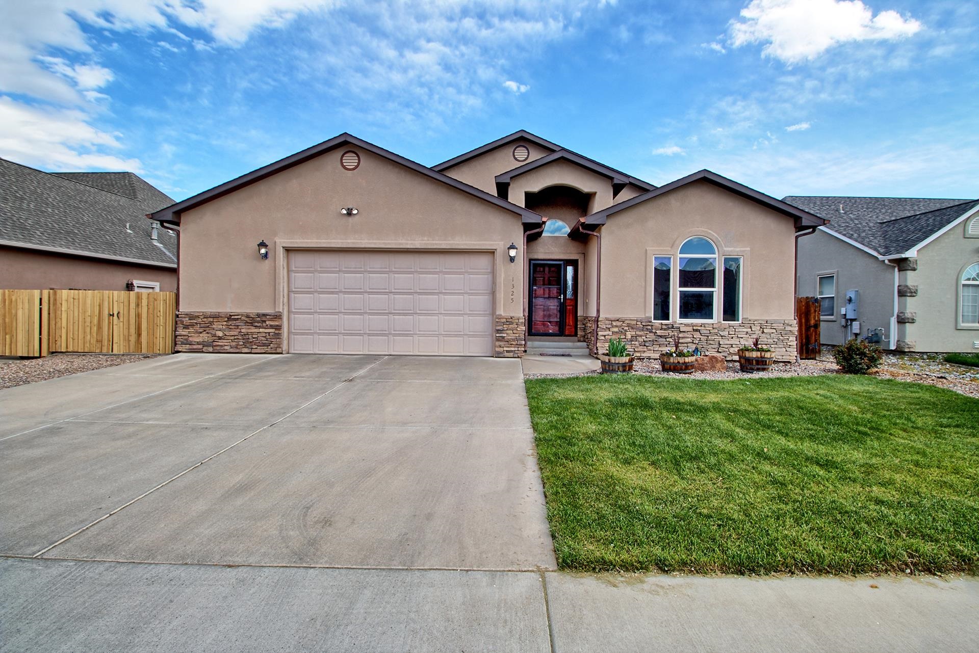 This beautiful ranch-style home features 4 bedrooms, 2 bathrooms, two living areas and an oversized 2-car garage. The home is situated in the desirable Vista Valley Subdivision and backs  to the 7-acre Vista Valley Park maintained by the City of Fruita. Highlights include new engineered hardwood flooring, newer carpet in bedrooms, gas fireplace, large garden tub in the master bathroom and RV parking/pad. Located just minutes from downtown Fruita and a short drive from popular biking and hiking trails.