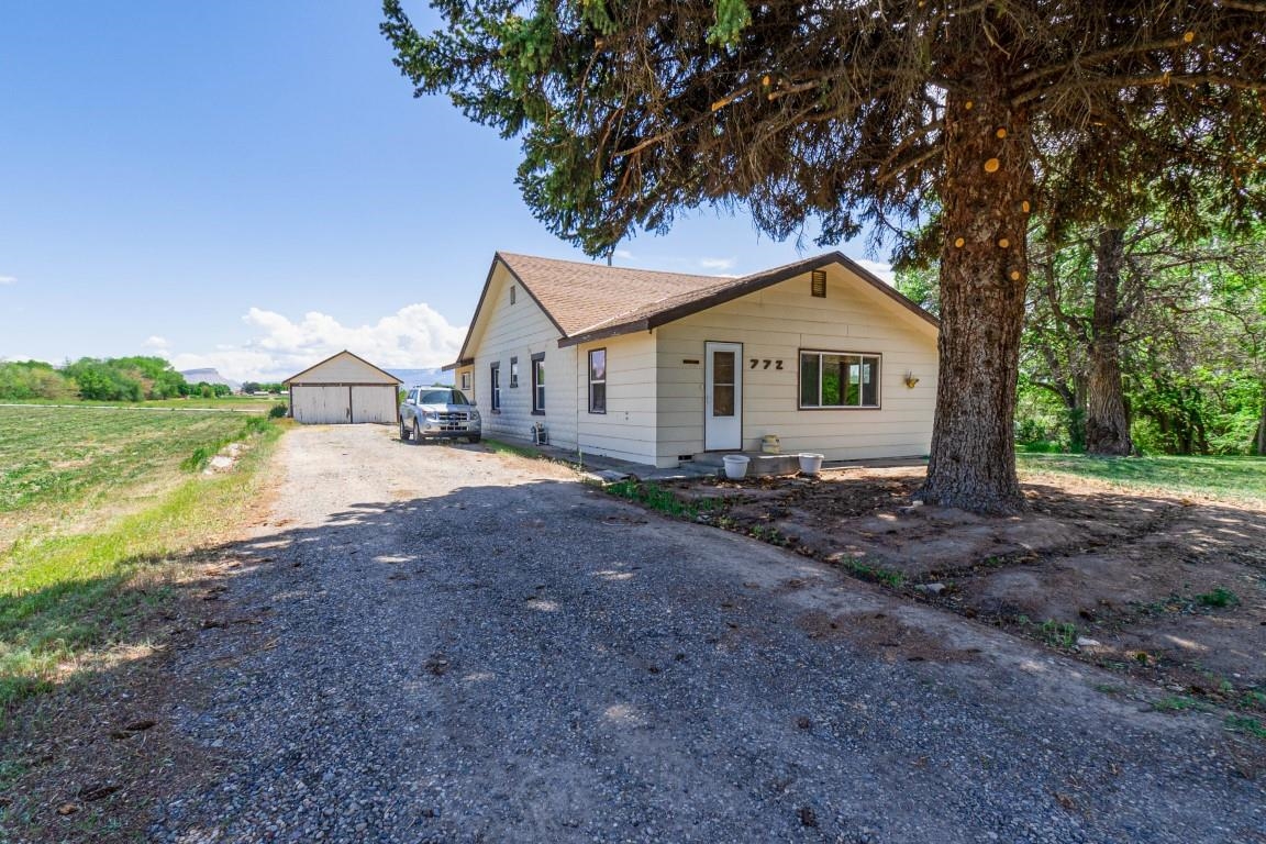 Great views and location! Minutes away from downtown Grand Junction and all amenities the city has to offer. Developmental potential with property zoned R-4. 8 acre Class 1 water rights which is equivalent to 32 acre feet of water through the irrigation season. Home is 1680 square feet with shop that is 1280 Square feet.  Lots of possibilities for this property such as a crop producing, Residence or just holding on for an investment. Build some corrals and bring livestock or horses and enjoy Grand junction living.