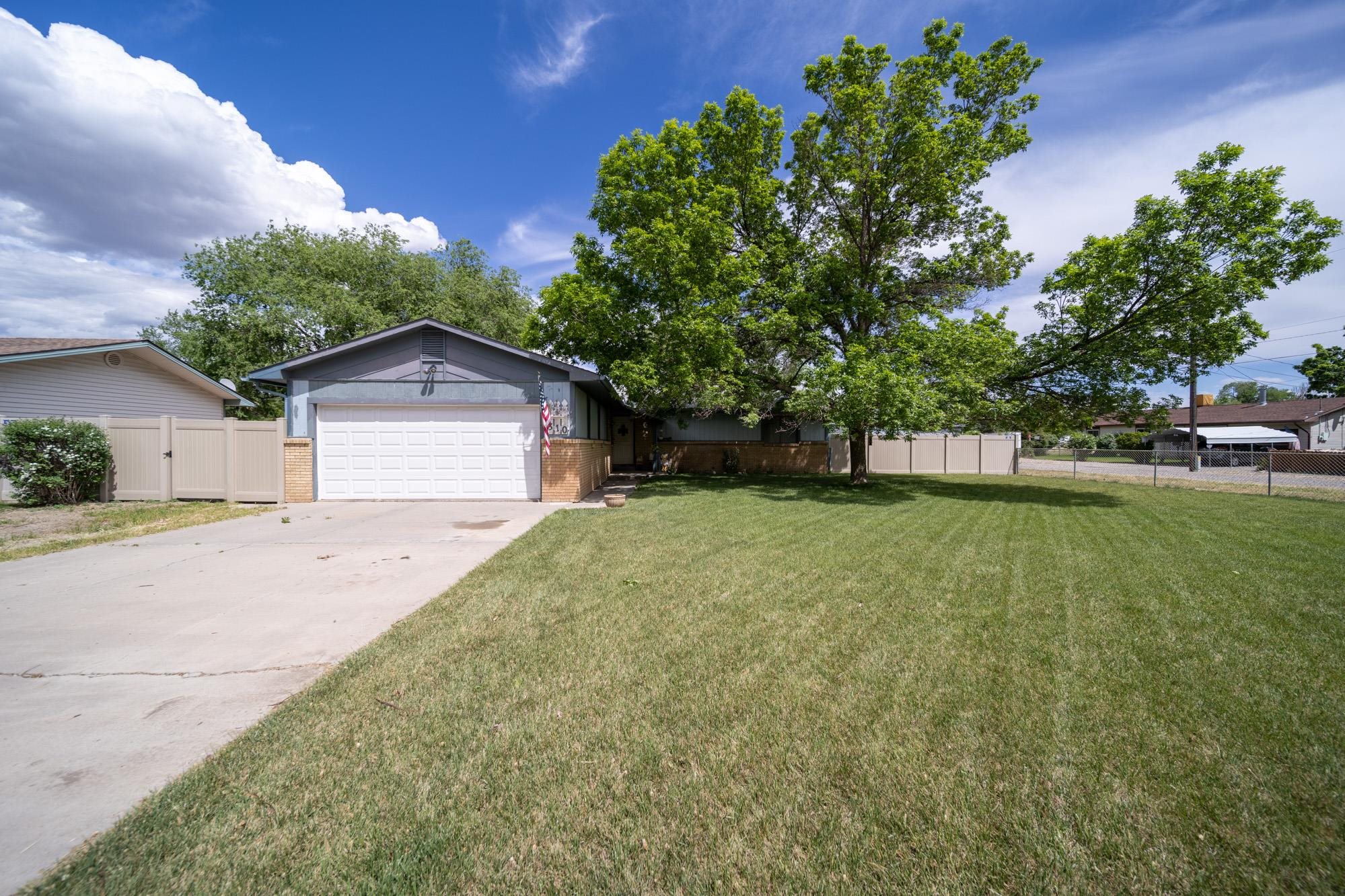 This quant home lies in the heart of Fruita, just blocks from downtown amenities, and Fruita Rec Center. Featuring an oversized corner lot with mature landscaping, RV parking, and two storage sheds. Inside you will find a semi open floor plan including a large living room with a wood burning fireplace.  Vinyl plank flooring, Refrigerator, and water heater were all installed in 2018, and vinyl fence completed in 2020.