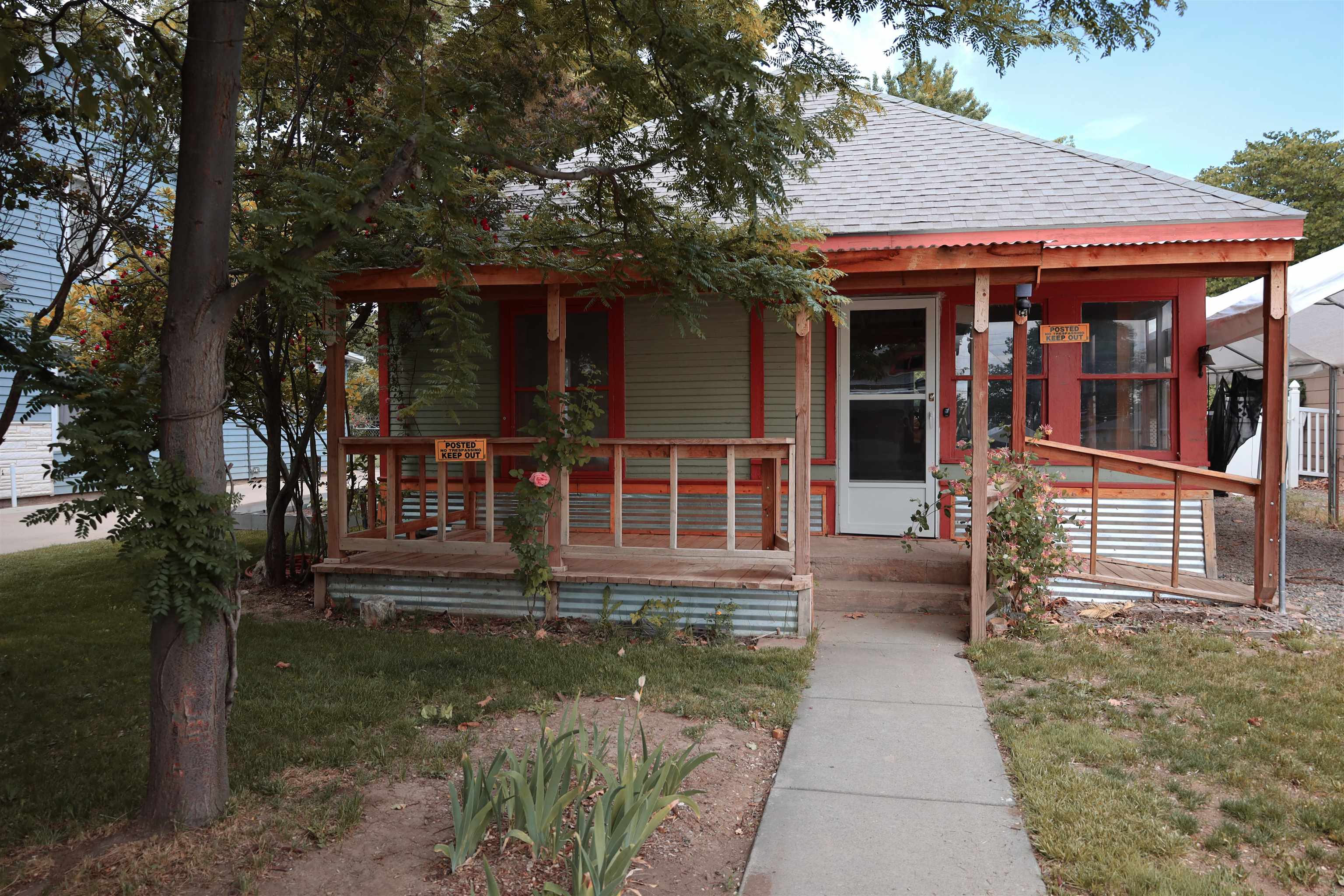 Downtown Fruita Fixer.  This 1 bedroom/ 1 bath, 864 square foot home is just oozing with charm and potential.  It features an open living and dining area that has abundant light, hardwood floors and detailed trim. The large bedroom opens to the living area and adjoins the full bath.  The kitchen, with a built in China hutch is waiting for your special touches.  Outside, you will find a covered front porch that overlooks the mature landscaping, a large carport with space for RV parking and 2 storage sheds to store your gear and gardening tools.   The exterior paint, electrical panel and roof have all been updated.  Don’t miss your chance for downtown Fruita living.  Schedule your private showing today!