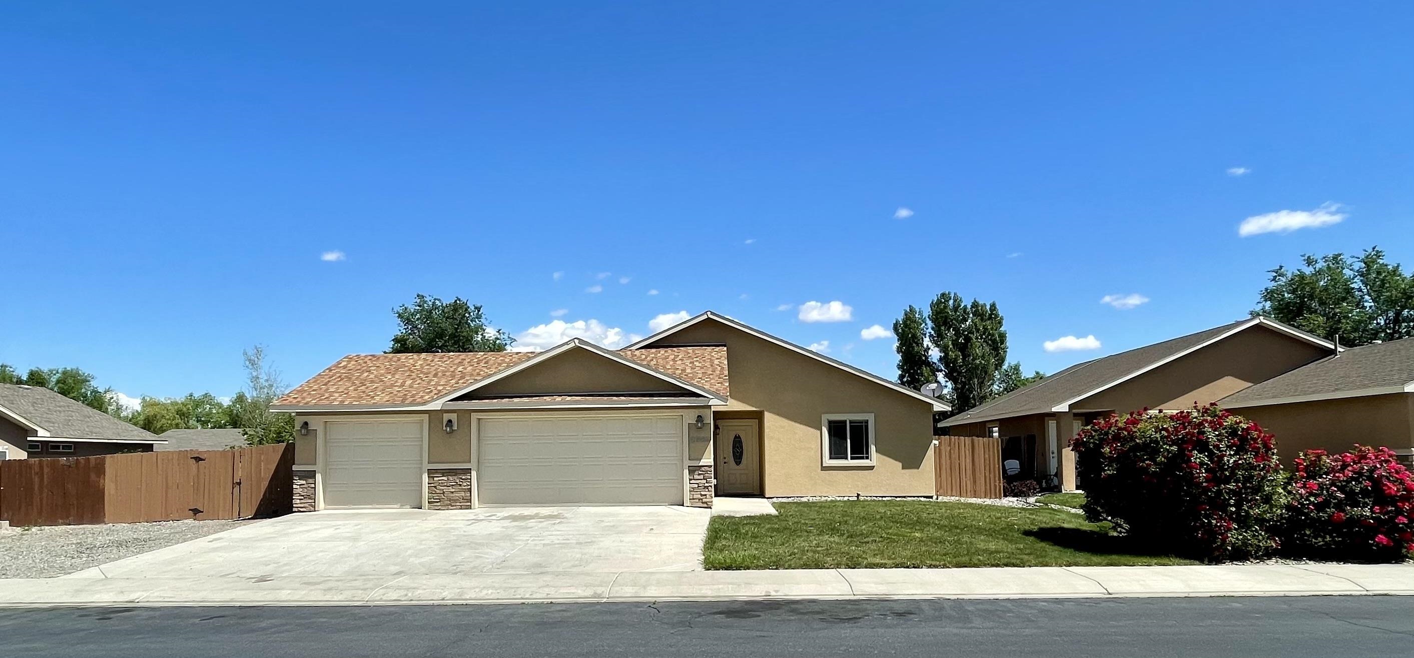 Welcome to this charming 3 bed, 2 bath ranch style home nestled in the desirable SE Grand Junction neighborhood. Boasting fresh paint, new carpet, and blinds, this home exudes a modern and inviting atmosphere. Situated with easy access to town on 30 Rd, you'll find convenience at your doorstep. Embrace an active lifestyle with the Colorado Riverfront trails and parks just a short stroll away. The property offers a spacious RV parking area, and the HOA provides irrigation water, ensuring a lush and well-maintained landscape. The 3-car garage, also recently repainted, adds both functionality and aesthetic appeal. Don't miss the opportunity to make this fully landscaped gem your dream home. Schedule your showing today!