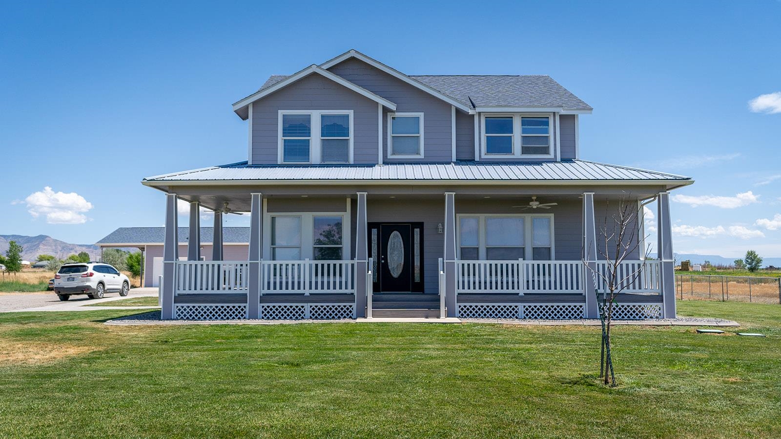 Seller is motivated and has adjusted the price to reflect! Ready for some peace and quiet with calming views? This large 4 bedroom, 3 1/2 bath home on 8.40 acres is the ticket! Owner has added a new exterior paint, new roof with a 50 year warranty, new composite decking, new interior paint, new carpet upstairs and new dishwasher. The primary en-suite has a steam shower and is located on the main level. Open floor plan with an curved staircase leading to the upper level along with a double sided gas fireplace visible from the kitchen and office. Separate gas fireplace in the main floor living room with a half bath located by the door leading to the 2 car garage. You will also find a private staircase that leads up to the secluded bonus room. Upstairs has 3 bedrooms; 1 with its own bath and the other 2 have a shared bath, a large laundry room with cabinets, counters and ironing board and the that fantastic bonus room. Large windows throughout the home allow for wonderful natural light. Cleaning is a breeze with central vacuum and surround sound. Outside you will find a shop with mezzanine and plenty of room for all your toys while enjoying the wide open spaces this great property has to offer. Shared entrance lane: property is on the left at the end of the lane. Private drive from that point on.