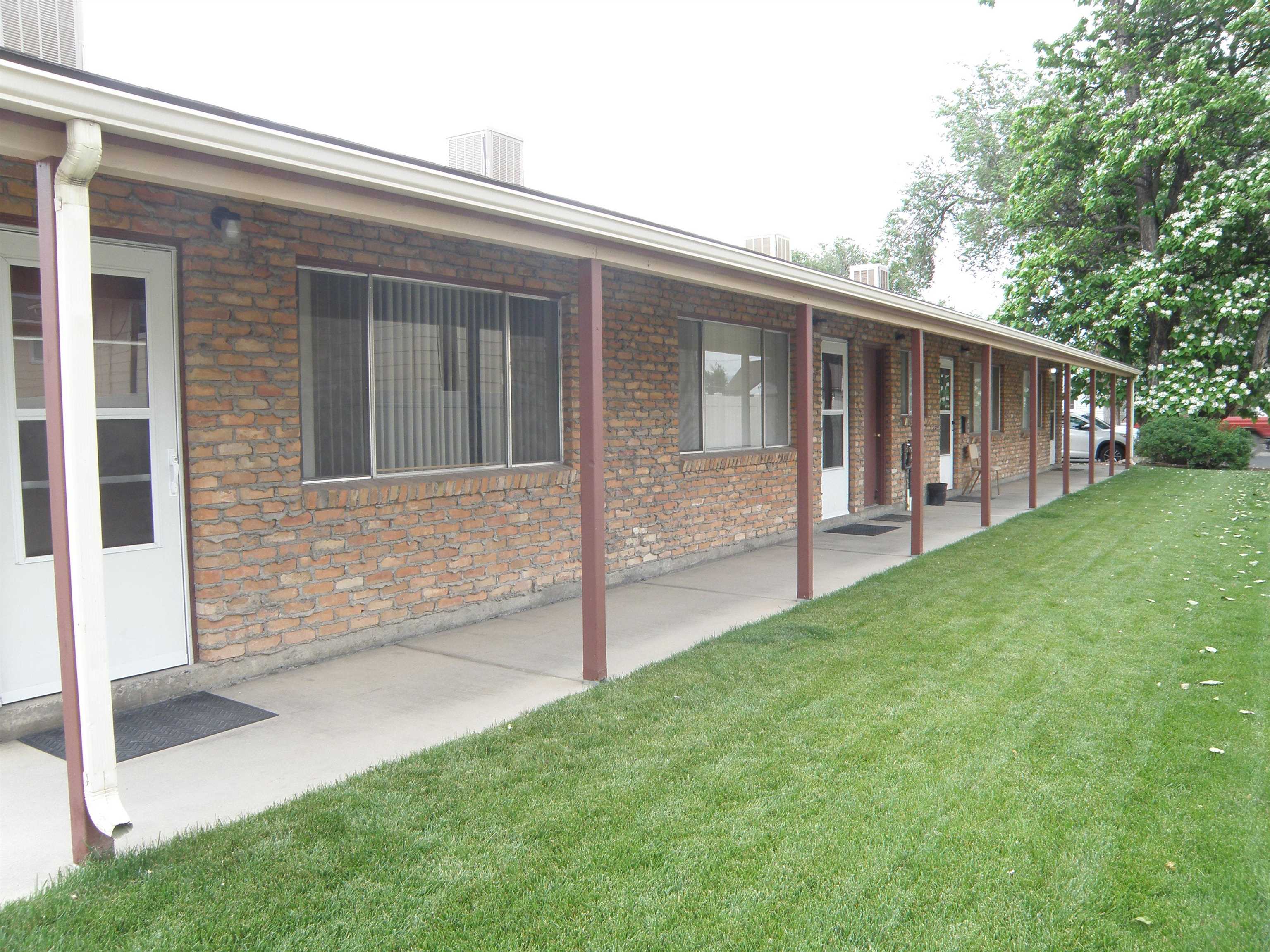 Rare ranch style 4 plex just 3 blocks from the college. Neat and clean property with newer roof, newer furnace & long time renters in place. Seller has kept rents low for renters as they have been very good renters. Should rent $875-$900 pretty easily. Large coin operated laundry room with separate storage closets for each unit. Designated off street parking for all 4 units. There is not a sign on the property.