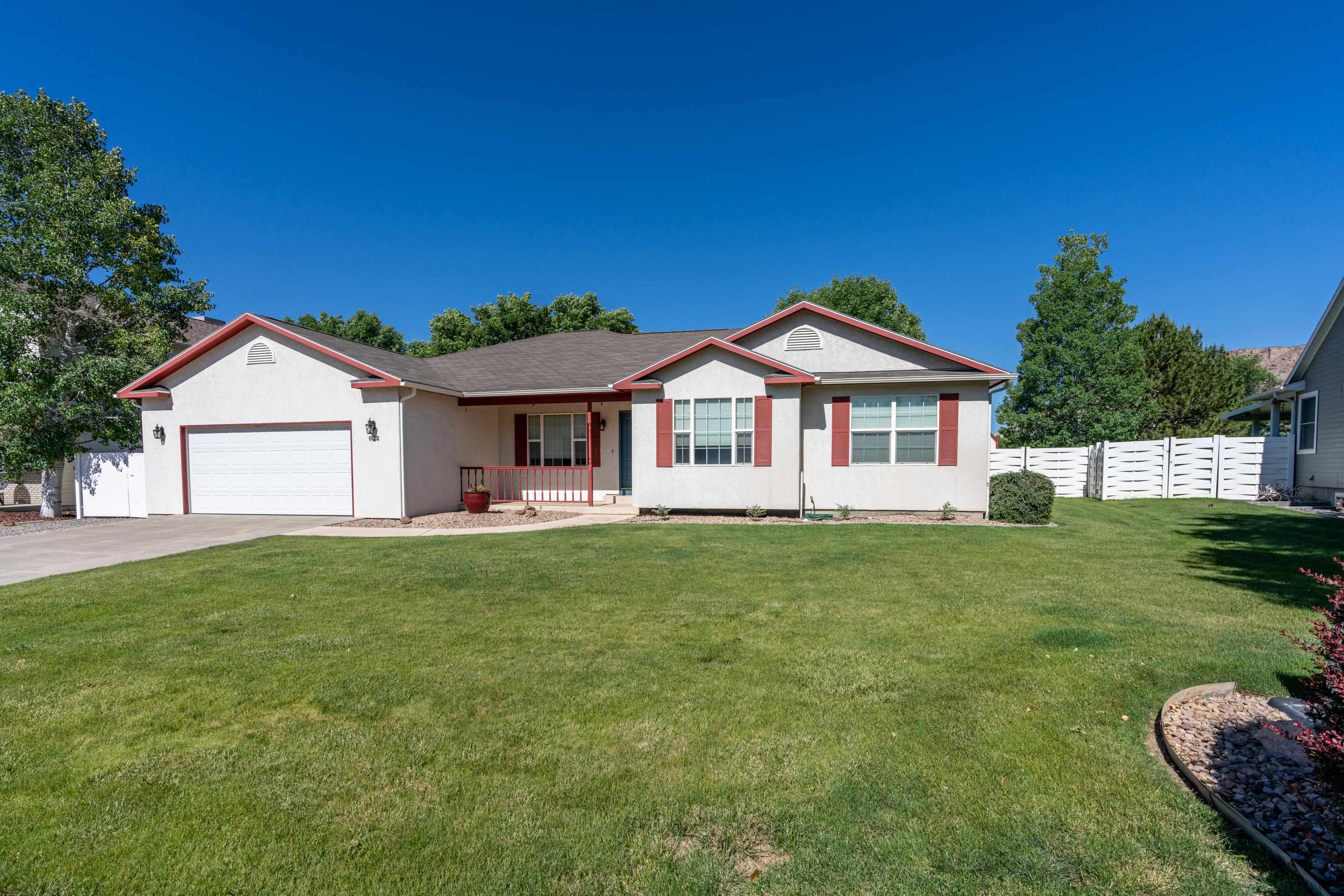 Your dream home located in the heart of Colorado wine country, Palisade! Nestled at the back of a quiet cul-de-sac yet walkable and bikeable to all things worth loving in Palisade! This lovely gem boasts 5 bedrooms + office, 4 bathrooms, a theatre room, new hardwood vinyl plank flooring, newer downstairs carpet, and a primary en-suite that will make you swoon! Large lot with RV parking and waste hookup, big storage shed, mature landscaping, and a covered back patio where you can enjoy our beautiful, Western Slope sunsets. There are views everywhere you look! Come see this wonderful home! Look at virtually repainted picture included in listing to get an idea what a simple little face lift could do to this gem of a house!