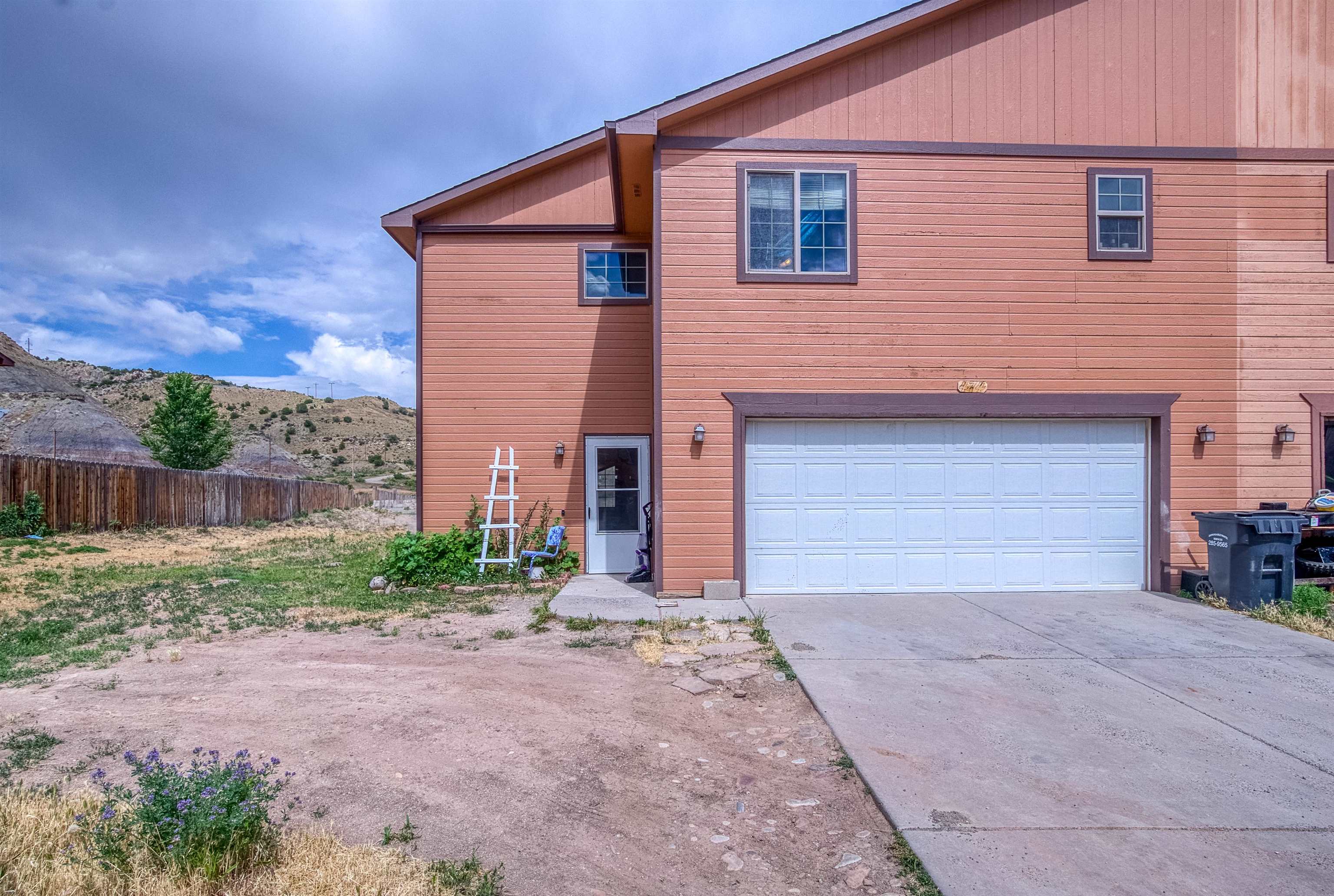 Welcome Home, located in the quaint Town of DeBeque this half duplex is within walking distance to the Restaurant, Store, Beauty Salon, Parks and School. It's just a short drive to the Wild Horse area. With 1,734 sq.ft. there is room to stretch and enjoy the quiet living.   The main floor features an open concept living, dining and kitchen area. The kitchen is great for the home chef with its ample counter space, numerous cabinets and large pantry. The powder room is conveniently located and talk about storage, this unit has plenty.   Upstairs is the owner's extra big bedroom with en-suite bath, dual separate vanities and huge walk-in closet. The two additional bedrooms are good sized and the hall located laundry area mean no lugging clothing up and down the stairs.  Did I mention the large, fenced back yard, plenty of space to plant the garden of your dreams. Town irrigation on the property and is paid with the water/sewer bill at $7.50 per month. The property backs up to DeBeque open space. Plus, there are no HOAs.