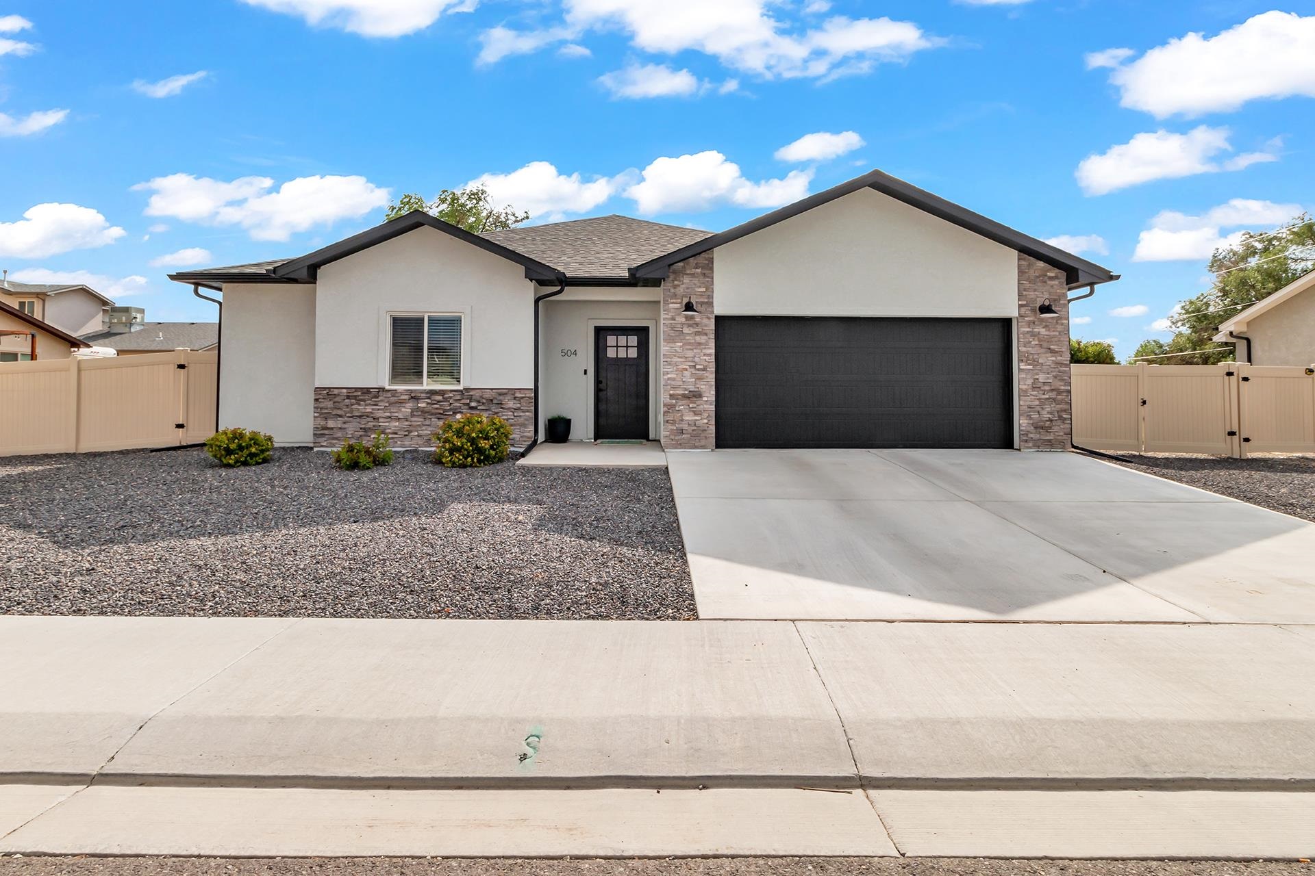 Newer construction in Pioneer Meadows featuring a functional, flowing ranch-style floor plan with a desirable split-bedroom layout! Large, open living room and kitchen is the perfect space for entertaining guests and comfortable relaxation. Kitchen features include: upgraded cabinetry, large center island, designer backsplash and cabinet pulls, oversized pantry and eat-in dining area!  Spacious master suite offers dual vanities, walk-in shower and large walk-in closet! Additional bedrooms share jack-and-jill full bathroom, with another half bath/powder room included for guest convenience. Large back patio with east facing views of the Grand Mesa to enjoy! Easy maintenance stucco and stone exterior, 2-car attached garage, full vinyl privacy fencing and plenty of room for RV parking on the north side of the property!