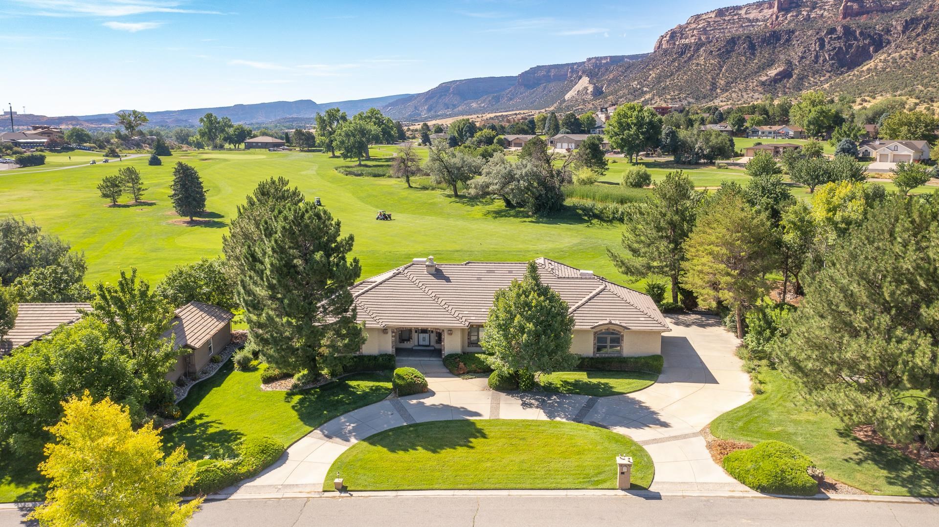 Open house on 11/29/2023 from 1:00 a.m to 3:00 p.m.   This meticulously cared for home sits on a maturely landscaped, almost half acre lot with unobstructed views of the monument and is adjacent to the golf course.  Take advantage of the wonderful views without the hassle of upkeep! The home boasts granite counter tops, luxury vinyl planking throughout, stainless appliances, central vacuum and a kitchen large enough for several cooks! The large living room allows for cozy evenings around the fireplace or views of the lush landscape. The master suite allows for privacy and serenity.  The bath allows one to luxuriate in the jetted tub and the master closet could be featured in any home decorator magazine.  There is plenty of room for a home theater or gaming in the bonus room in the basement.  The jack and jill bedrooms are connected with double vanity bathroom and closets.  Storage space is also available in 3 separate ‘crawl space’ accesses, as well a full-sized utility room.  Extra storage is also available in the laundry room. Solar panels are paid!! Last electric bill was only $11.00. Set up a showing today!