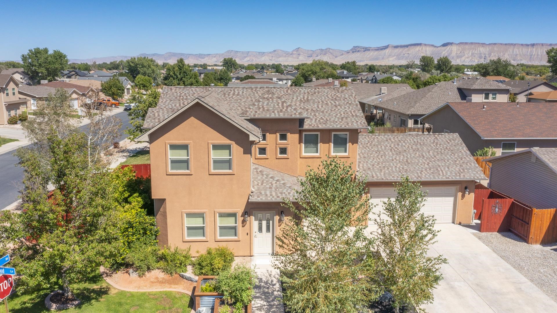 This one checks all the boxes! Great corner lot, fully revamped landscaping with  raised garden beds, 3 spacious bedrooms, 3 bathrooms, various updates and under 400k! Located in the SE area of Grand Junction in a great neighborhood, this home offers endless possibilities for any family or buyer. The main level provides a nice flow from the living room to the kitchen and dining room. Upstairs you'll find all the bedrooms: a cozy master bed with great updates and an ensuite bath as well as 2 other bedrooms along with another full bath. The yard provides great space for entertaining and BBQ's as well as the garden beds to satisfy anyones green thumb. This home has it all, come check it out today!