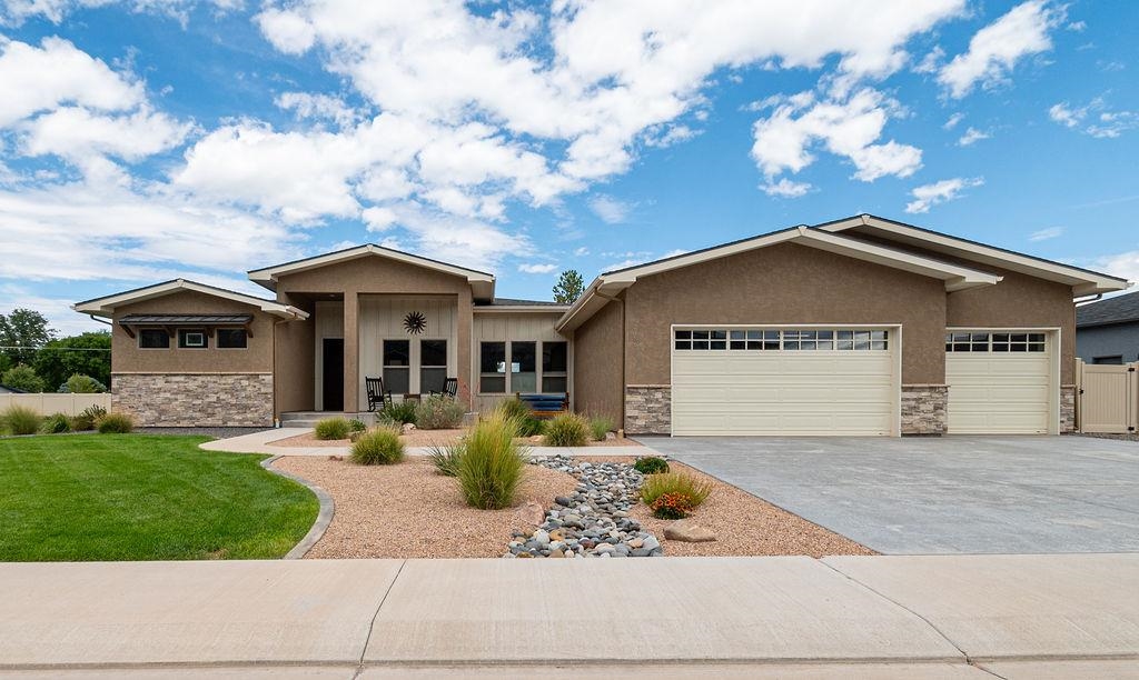 Quality Rancher in Granite Falls Subdivision.  Open floor plan with custom features throughout.  The front study/office could be a 4th bedroom if needed.  Kitchen open to all the living space and a dining area, large counter/bar convenient for gathering around, large pantry, custom quality cabinets.  Split bedroom design, large master bedroom suite with huge custom closet large shower, double vanity, tub.  Large, heated 3 car garage with added space for a workshop or storage.  Laundry/mud room to the house with a 1/2 bath.  Fully landscaped with RV parking.  House has excellent views and borders the subdivision open space, so no neighbor on that side.  Large covered patio.