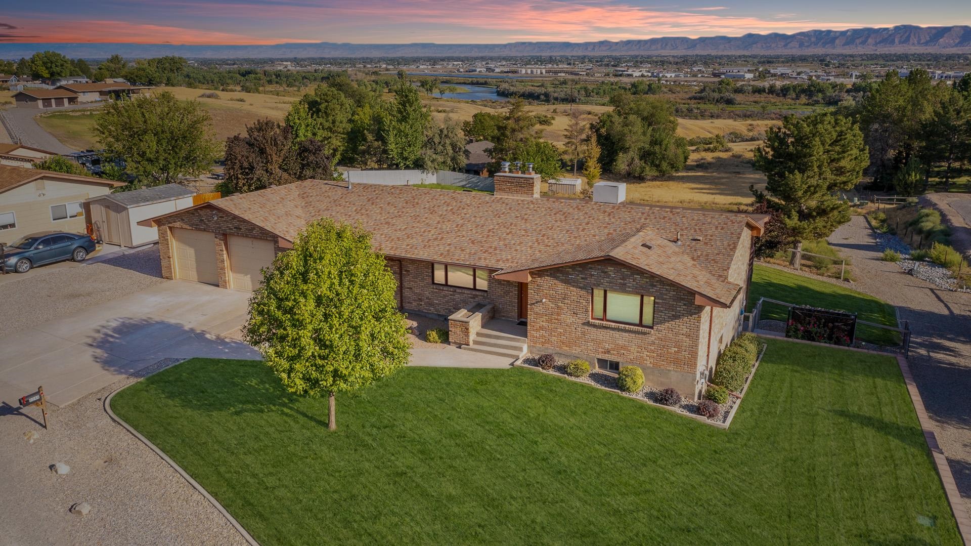 Wonderful Redlands location w/ plenty of room for everyone & everything!! Don't miss your chance on this fabulous 5 bed, 4 bath, oversized 2 car garage home that sits on 1 acre w/ great valley views!! Main level has spacious living & dining area, nice kitchen, gracious master w/ 5 pc bath, his/her closets, & access to large deck & an additional guest room w/ private bath. Downstairs you will find 2 beds, full bath & large bonus room. There is also a large family room, guest room & additional kitchen w/ separate entrance making this a great space for mother in law set up!! Tons of updates through out! Outside you will find a LARGE deck & covered patio overlooking the valley & fully fenced mature landscaped yard. There is an additional yard space that is ready for your creative touch, space for a garden & RV Parking galore. Come see all this one has to offer!!!