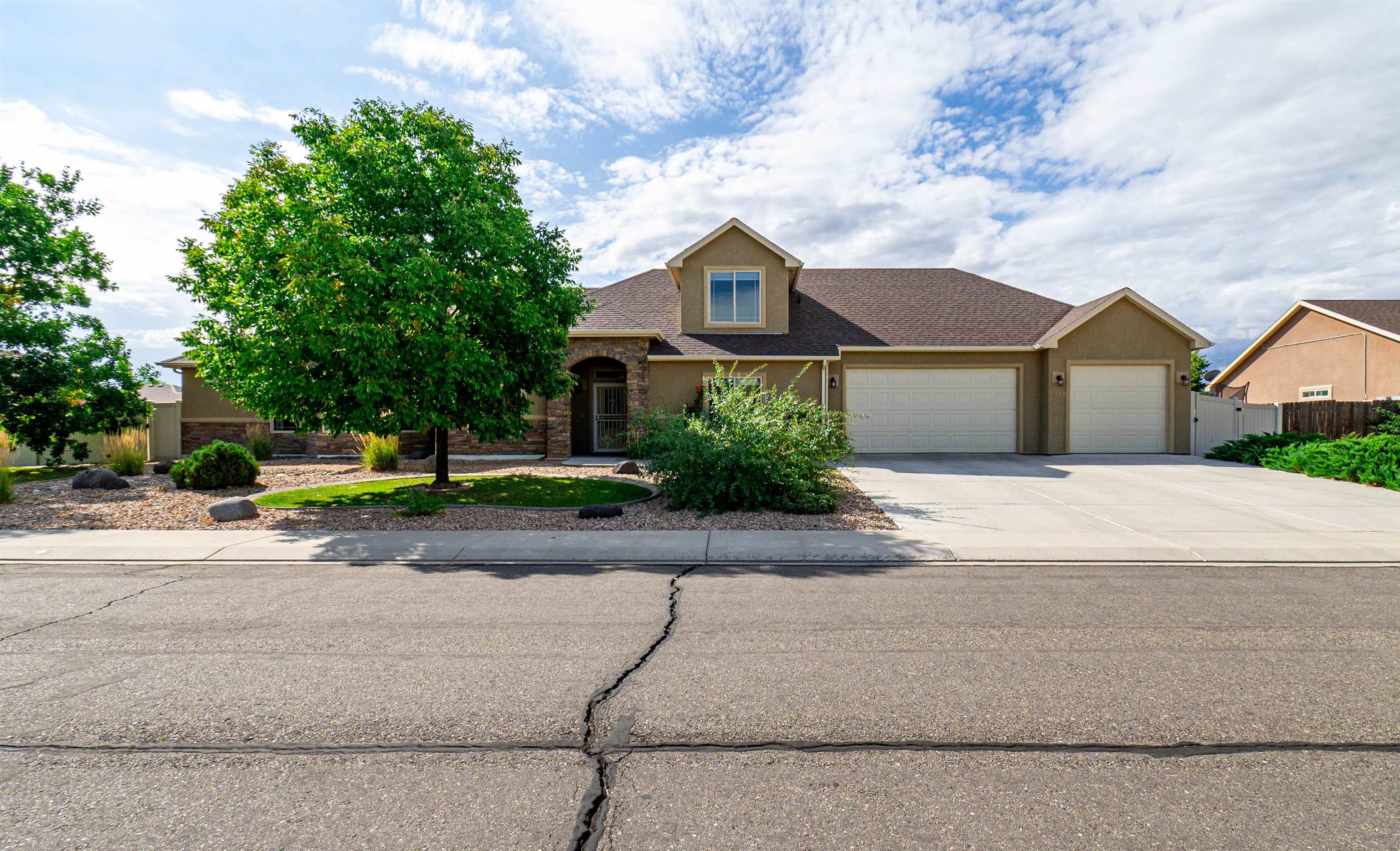 Bright, well kept ranch style home with lots of great features! Spacious kitchen with solid granite counter tops, stainless steel appliances and kitchen bar which connects to the living room, great for large gatherings. The 5th bedroom or bonus room upstairs gives you lots of options. You will love the large master bedroom with private 5-piece bath in this split bedroom design.  Interior paint, carpet, tile, window blinds and gutters replaced in 2018. Dishwasher, microwave and security door at front new in 2020. Covered back patio and low maintenance landscaping, 2 raised garden beds and plenty of storage space on southwest side of backyard. Excellent Fruita location right next to a park! Get inside this home!