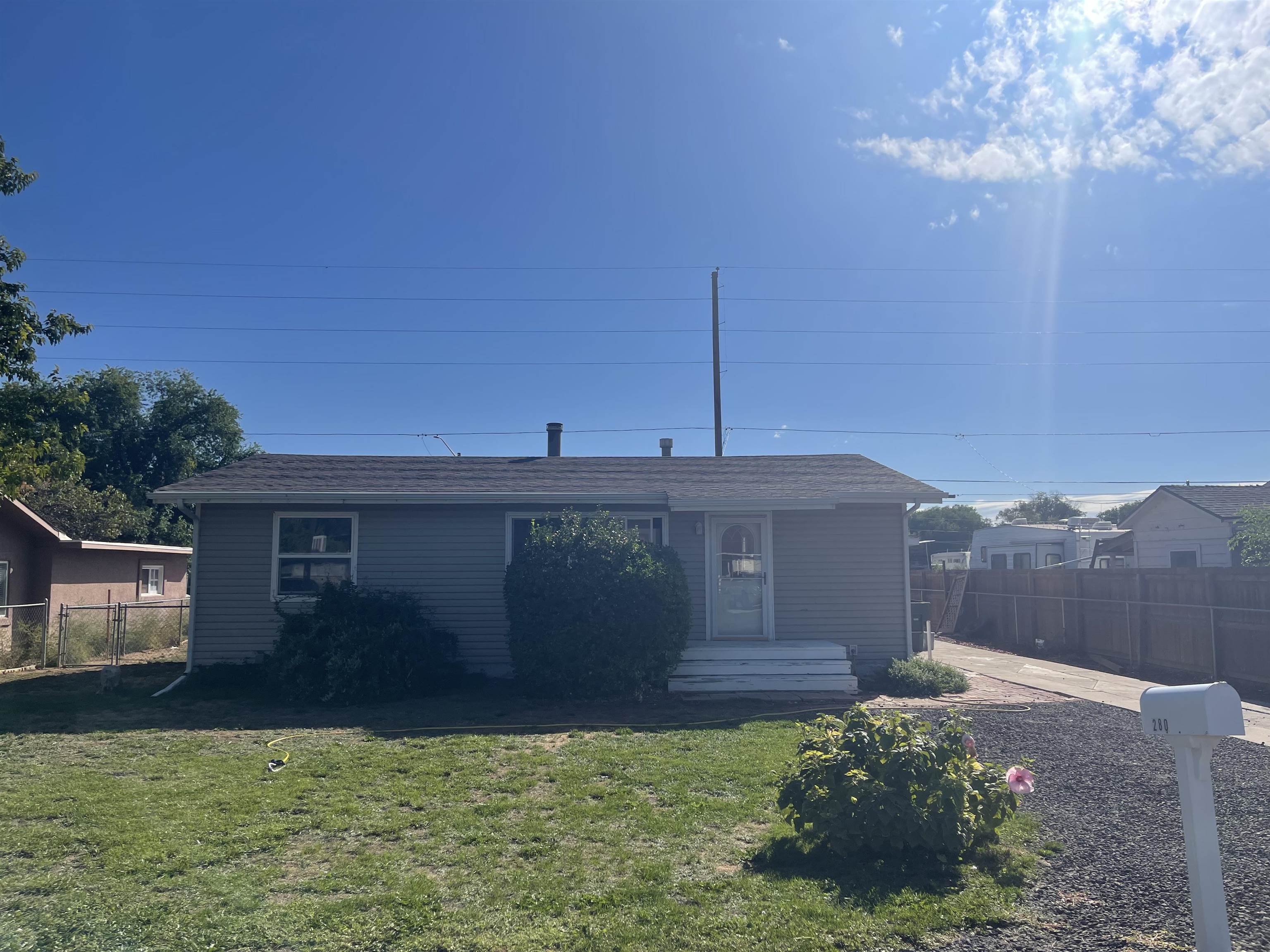 Seller has been working hard to make sure this home is ready for new owners and now is your chance!  This 988 sf home with 2 bedrooms, 1 bath sits on a .20 acre lot with a 1-car detached garage and RV parking inside fence with access from 27 1/2 Road.  In the last year this home has been blessed with fresh interior paint, new flooring, a new commode.  New water heater was installed in 2022.  Windows throughout, bathroom remodel and plumbing under the home replaced in 2010.