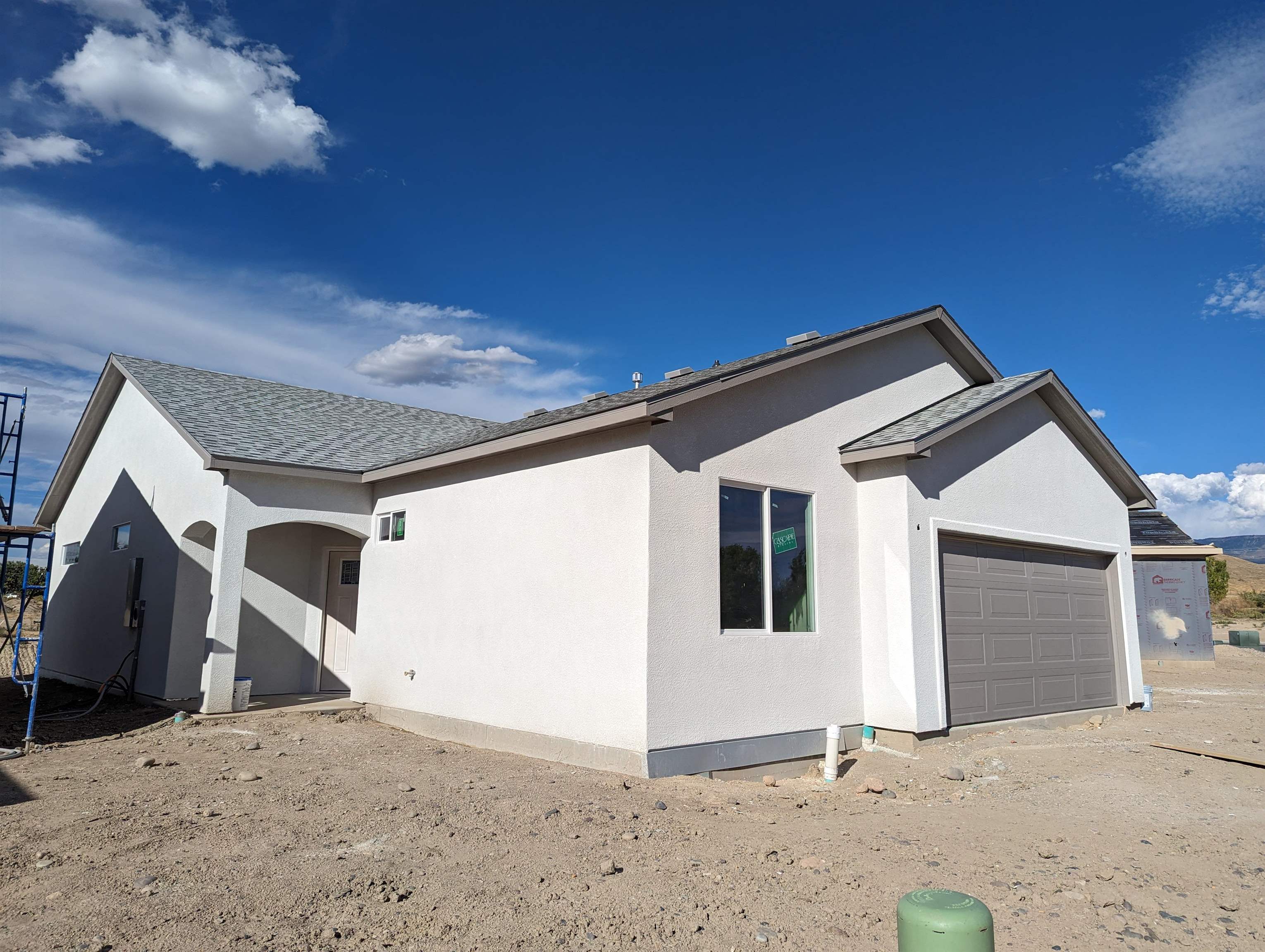 First Fully Improved Urban Subdivision in Whitewater.   USDA Loan approved area. USDA provides homeownership opportunities to low- and moderate-income rural Americans through several loan, grant, and loan guarantee programs.  3 Bedroom, 2 Bath Open Floor Plan designed for entertaining. Gray and White Color Scheme throughout. Quartz Counters in Kitchen and Baths. Modern lighting throughout, including retractable Fan Ceiling lights in Living and Master, & auto on Pantry Light.     Rear covered Patio and large back yard that adjoins to open space. Front yard Landscaping Included! RV parking on Side of Garage! Fiber optic Data connection available. Hiking via Old Spanish Trail nearby. Grocery: 32 Rd. 3 min Drive Store-8 min Drive, Downtown G.J.-14 min Drive, Riverside Pkwy & 12 min Drive.