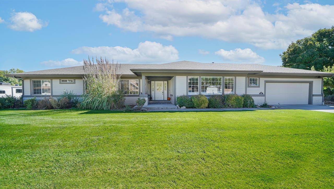 This home is on the doorstep of the Colorado National Monument and backs to the 4th Fairway of Tiara Rado Golf Course. This property offers 4 bedrooms, 2 bathrooms, 2 car garage, and RV parking! A ranch style open floor concept with a huge master suite is incorporated with a beautifully remodeled master bathroom. The kitchen has been remodeled with granite countertops, quality cabinets that offer soft close features, recessed lighting, new LVP floors, and stainless appliances. Newly painted on the interior and exterior. Brand new roof! Plenty of windows throughout the home offering lots of natural light. It's all been done! You'll want to spend every evening on your back deck watching the Bookcliff mountains put on their light show! Walk to the club house for lunch or dinner and enjoy the golf course lifestyle while soaking in all the unrivaled VIEWS!