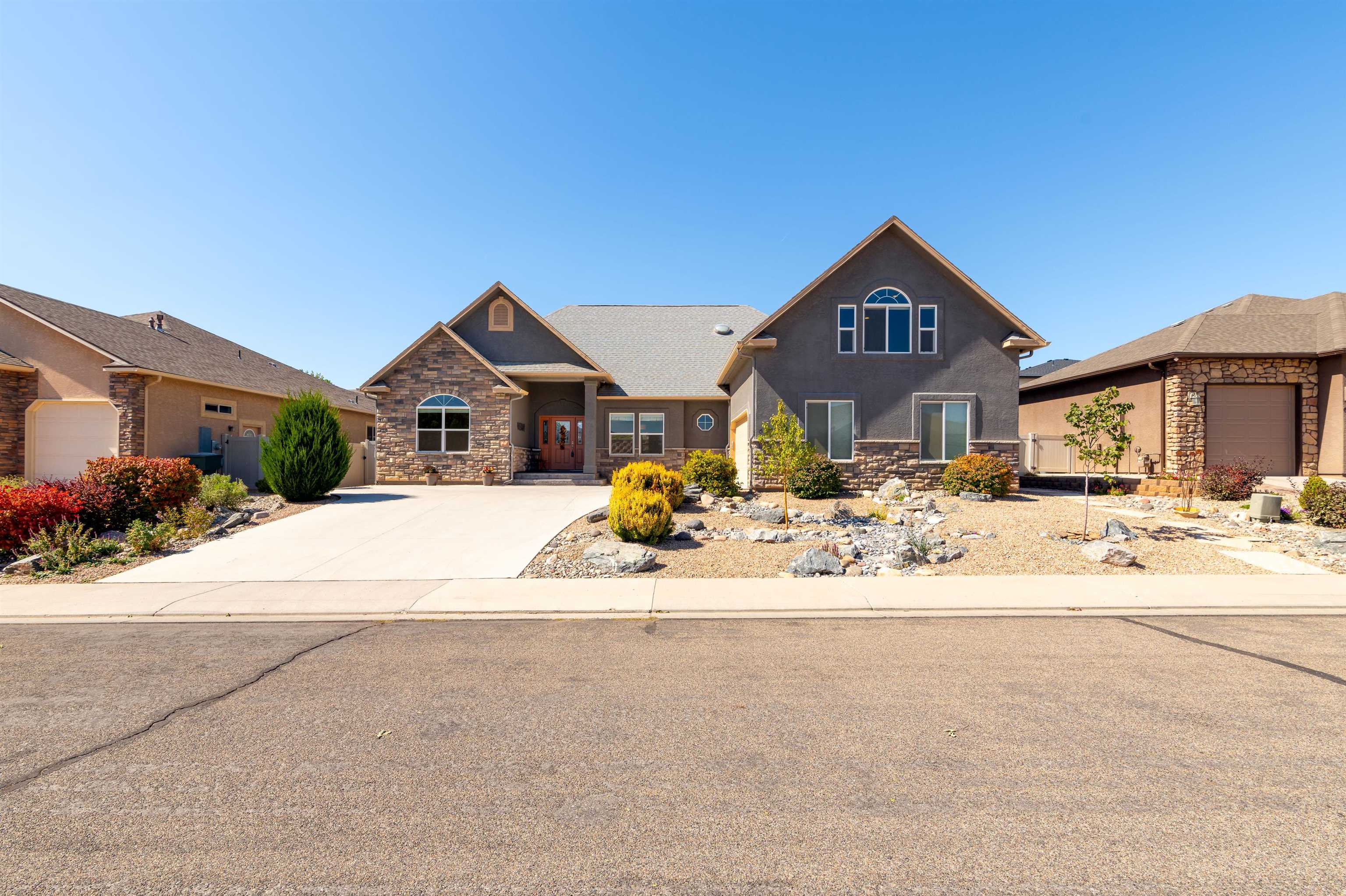 Welcome home!  Centrally located in North Grand Junction, this home has been expertly updated and incredibly well-maintained inside and out and is the epitome of 'move-in ready'.  Outside you'll find a low-maintenance yard with covered patio space and lots of room for terraced gardening.  Inside you'll be pleased with the easy flow of an open concept living area, cozy fireplace, and fine finishes throughout give a smooth, contemporary feel. The bonus room with a half bath make for a great executive office space with gorgeous Grand Mesa views. Don't let this one slip by!  Book your private showing today!