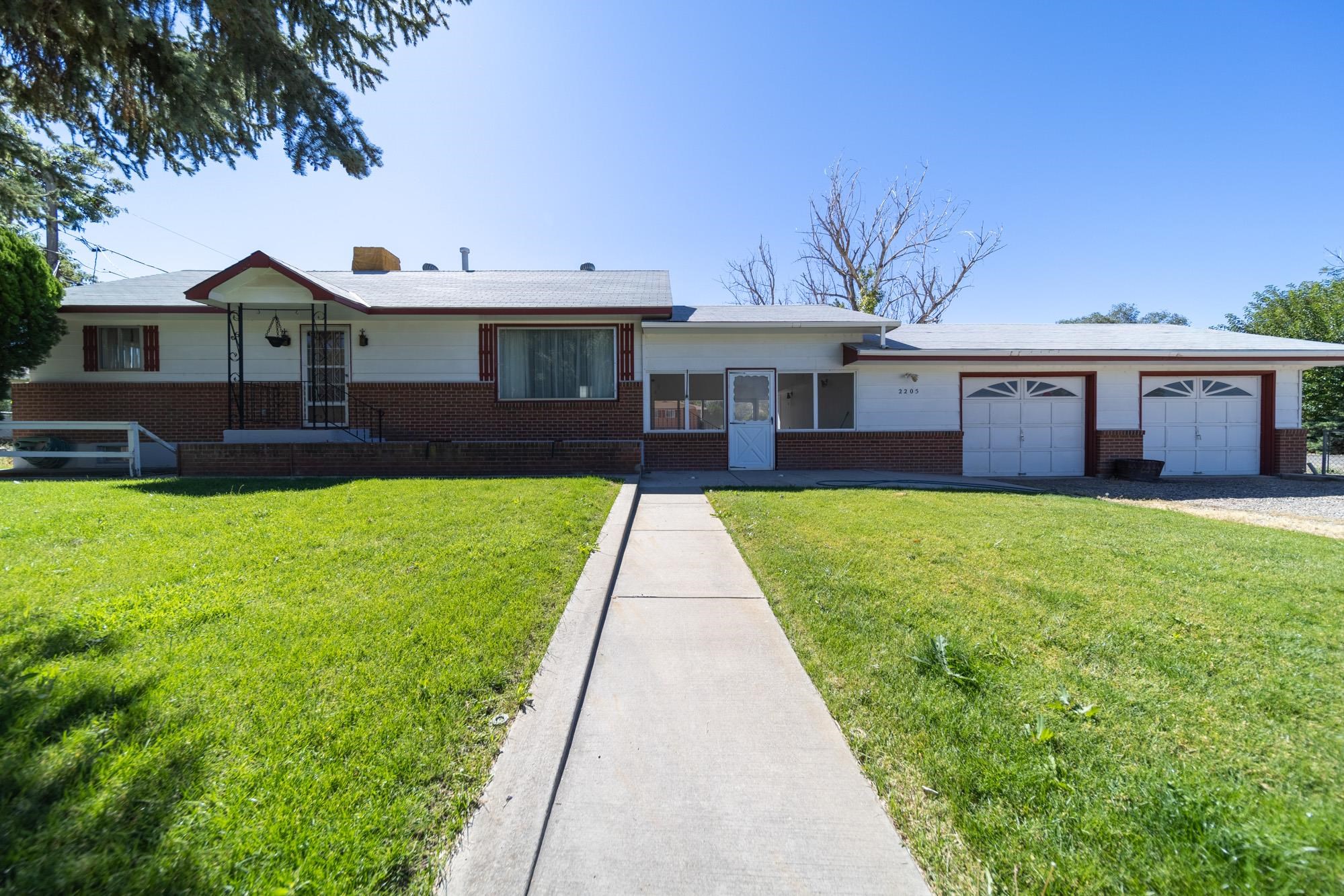 Located in the sought after Redlands area of Grand Junction, this home has all the views! Plus new carpet and new paint in the basement. Step in to this mid century modern work of art!  This charming residence offers 3 bedrooms, 3 bathrooms, and breathtakingly beautiful views that will captivate your heart from the moment you step inside. Beautiful sunroom, and living spaces both on the main level and in the basement give the opportunity for whatever you need! Home office, gym, crafts, you name it! Did I also mention NO HOA and RV Parking as well as 2 car garage? Garage offers parking for 2 cars, and storage plus a work bench. Gorgeous views of our Colorado National Monument and a herd of deer visit you frequently, so stock up on carrots and apples!