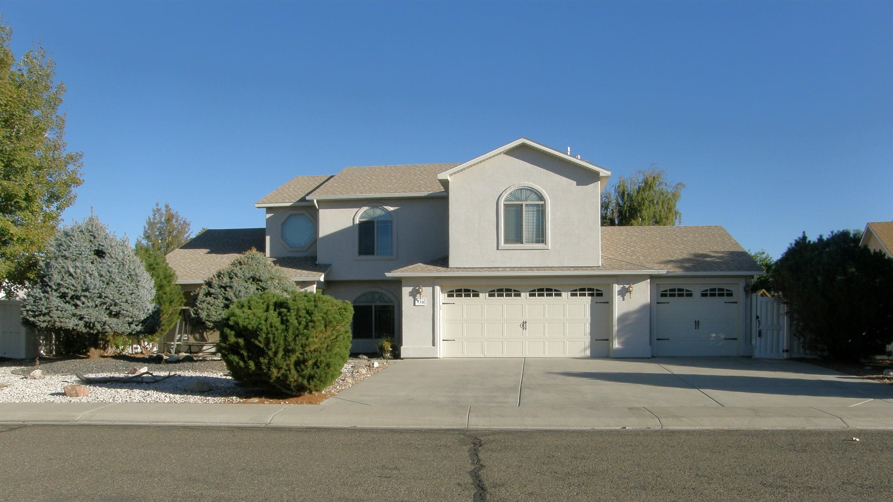 Good home design means easy living and gracious entertaining, indoors and out. Prime location offers easy access to all that the Fruita and Grand Valley has to offer. This home has 4 bedrooms  4 bathrooms and a living and a family room!  Also upstairs there is a nice bonus room, crafting or an office?  The 3 car garage also has a separate workshop or storage room. There's a backyard playset and even more extra storage in the shed in the backyard!  You will enjoy the covered patio in front and backyard in this well maintained home.  Take a walk to the nearby parks in this beautiful neighborhood.