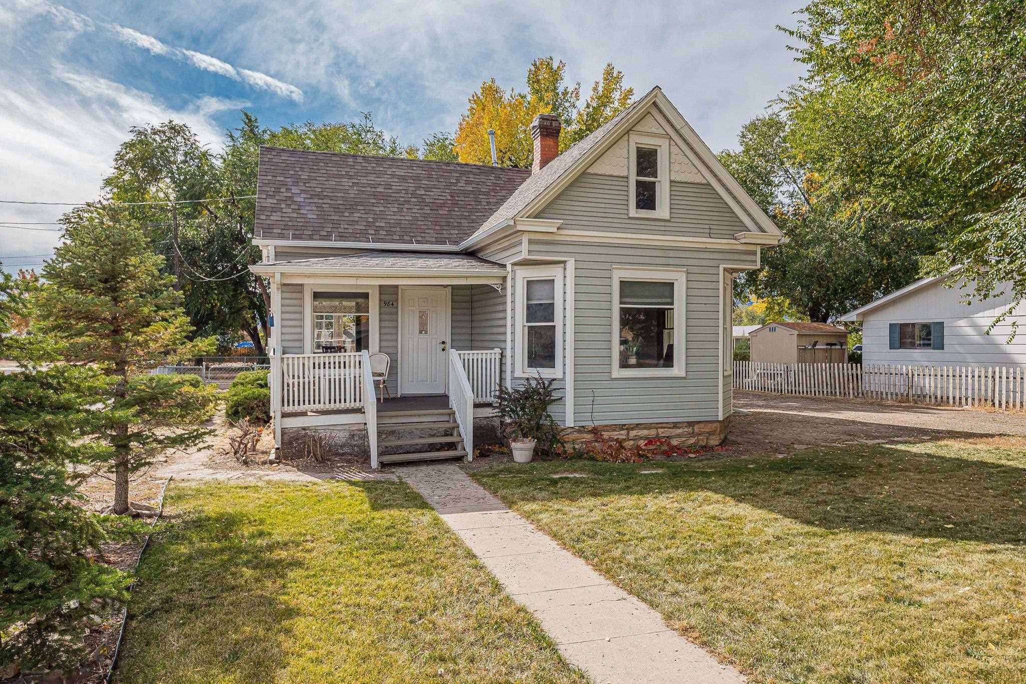 Downtown Fruita!  Don't miss your opportunity to own this Victorian style home that is on the list of Fruita Historic Places. The main floor of this charmer features hardwood flooring throughout, a large living/sitting room, a dining room with built in hutch, a sunny kitchen, a bathroom with a claw foot tub and a cozy bedroom.  Upstairs is a second bedroom with a sitting area and a large finished attic space that could be used as another bedroom, playroom or living area.  Updated features include central air and an on demand hot water system.  Outside, there is a covered front porch to sit and enjoy your morning coffee and a back deck that overlooks the large backyard. The corner lot has ample space to build a garage, park your RV or add an ADU.  Buyer to verify with the city of Fruita.