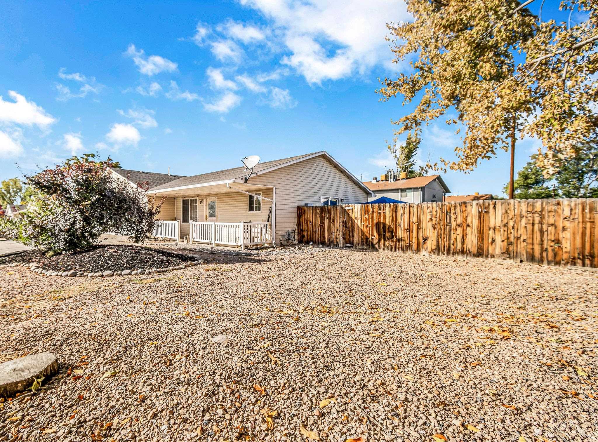 Corner Large Fenced Lot with sprinklers in backyard!!  3 Bedroom and 2 Bath with a  2 Car Garage.  Great place to live.  Lush green irrigated backyard adds to the comfort living with home located on a corner lot and front yard with xeriscape.