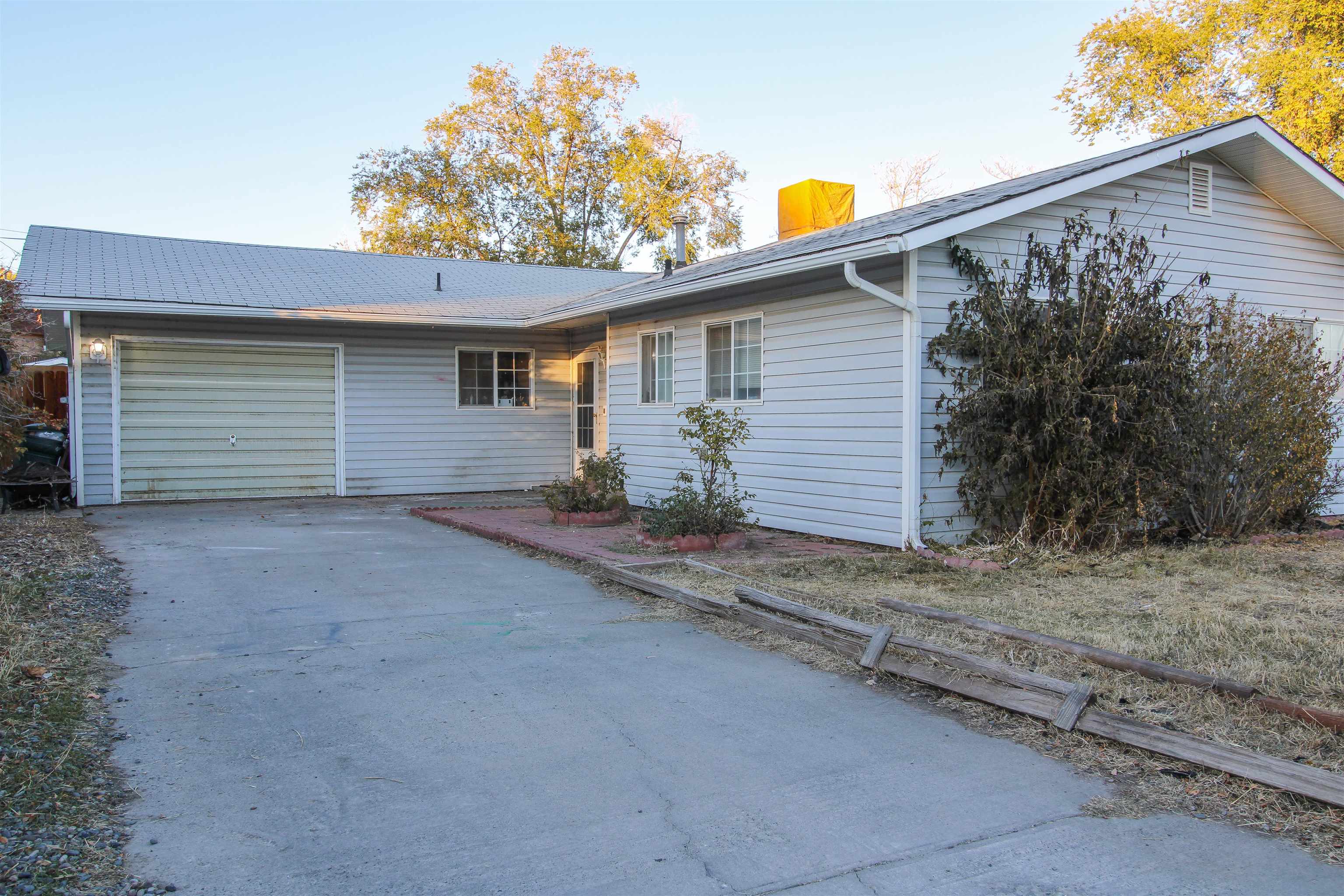 Opportunity awaits! Located less than 10 minutes from downtown and CMU, this home offers 3 bedrooms, 2 bathrooms, RV parking, and no HOA! The huge backyard comes with two shares of irrigation water and includes a large storage shed providing ample space for storing tools, equipment, or outdoor gear. Don't miss the opportunity to put your personal touches on this home and make it yours. Schedule a showing today!