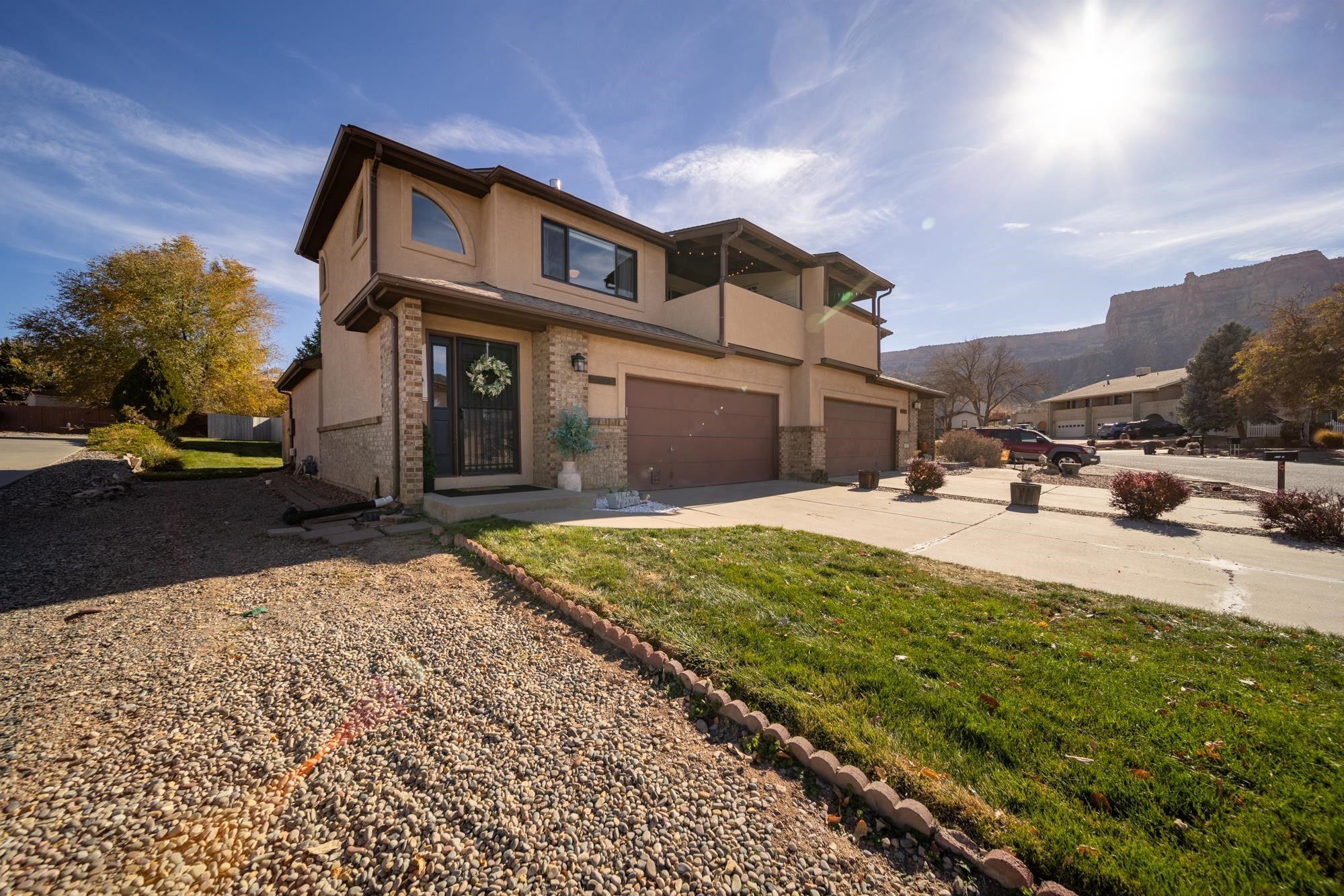 Beautifully updated Townhome in the Redlands. Home is located across from Tiara Rado Golf Course. This 3-bedroom 3-bathroom home has amazing Monument views! Home is currently being used as a successful short-term rental. Two story design features primary suite on the main level with access to cozy private patio. From the upper level you will enjoy a large living area, open concept kitchen and dining area as well as a covered deck all of which looks out onto those fantastic Monument views. Updates to the home include interior paint, updated bathrooms and updated kitchen including granite countertops. Not only does it include an attached 2 car garage but ample storage space throughout the home as well.