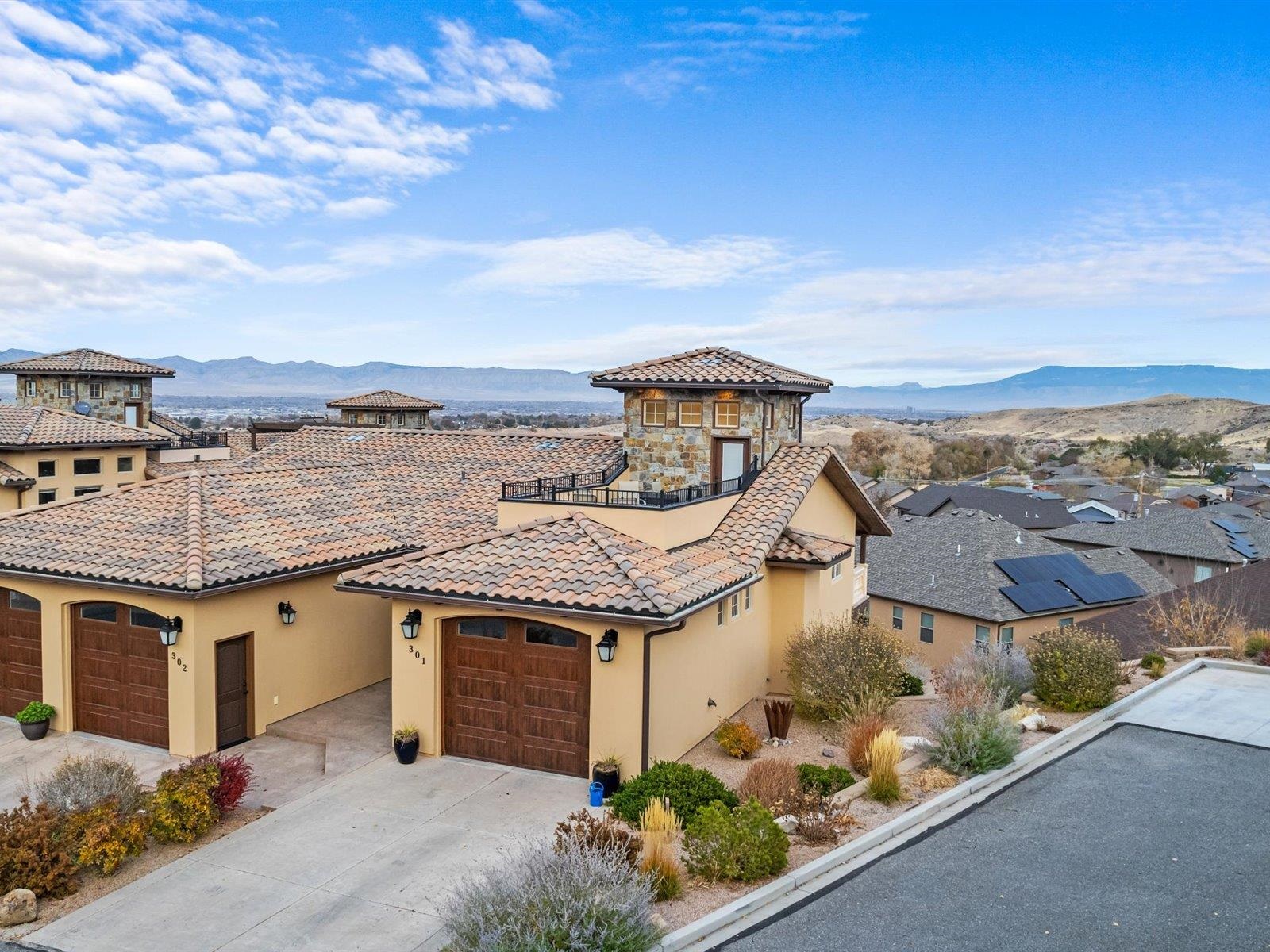 Located just a few steps away from Tiara Rado Golf Course & Clubhouse are the Vistas at Tiara Rado Condominiums. This really is turn key luxury living at its best in the Redlands.  Granite countertops,  stainless steel appliances, teak wood deck & much more. You will not be disappointed in the quality, amenities, features or views. This home features 3 bedrooms, 2 baths & a 1 car garage, plus a designated parking spot on site. A covered patio as well as a rooftop terrace giving you the most outstanding views of the Colorado National Monument, Tiara Rado Golf Course and The Grand Mesa. Plenty of extra storage in the storage room off the garage for golf clubs and toys. Whether this is your primary residence or lock and leave, it doesn't get any better than this.
