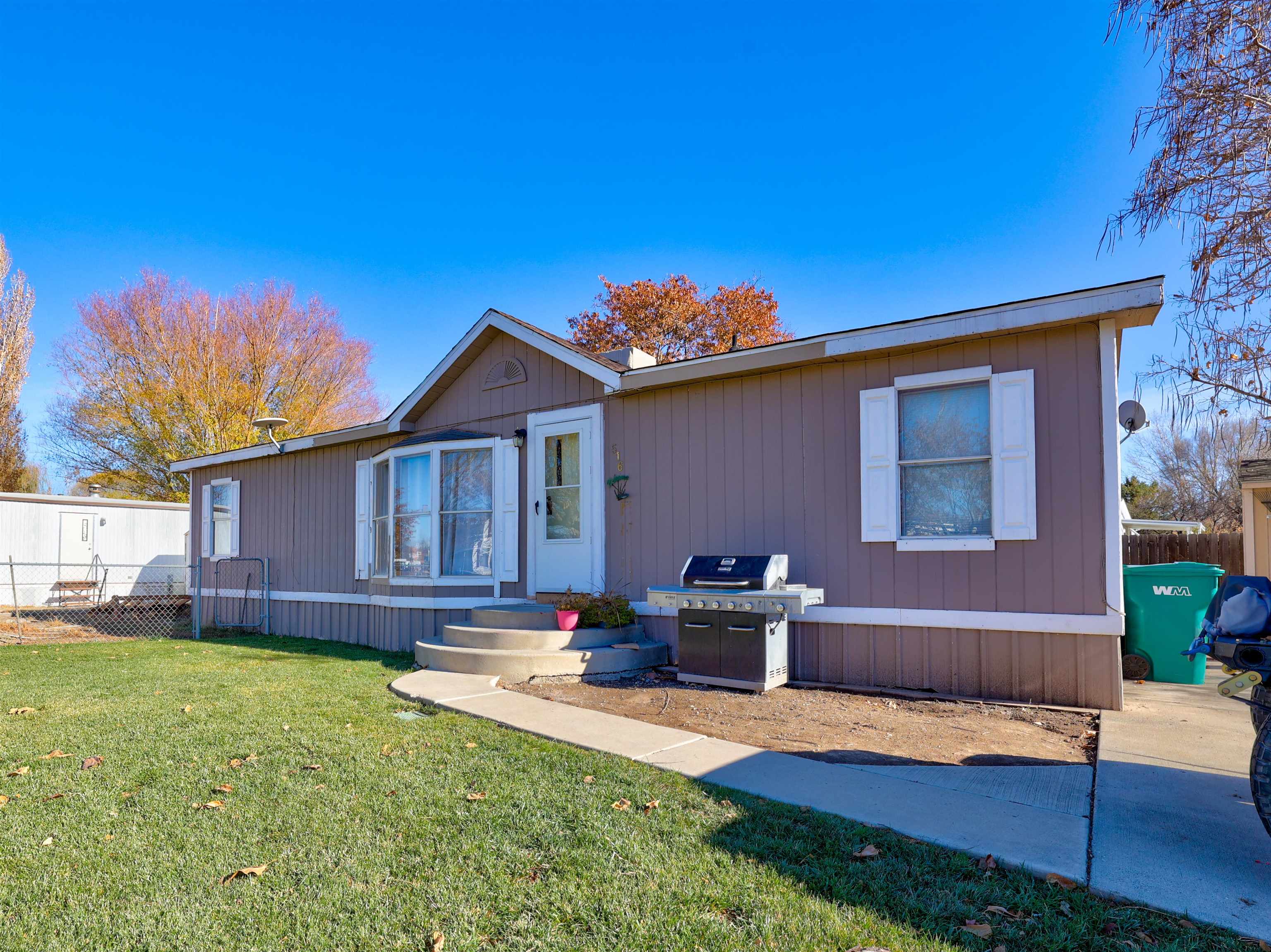 Affordable opportunity in Fruita! No lot rent on the biggest Lot in Holly Park, which offers 2 parking areas with room for RV parking and a garden! Includes a great storage shed, beautiful new lawn fenced in for your pets! This super cute double wide home has a split floor plan, with 3 bedrooms, two baths, plus an office, light and bright and an easy entertaining layout.  Don't miss out on this one!!!