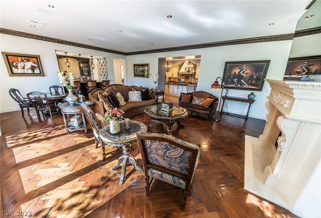 Incredibly spacious family room with magnificent marble fireplace.