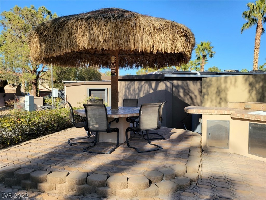 Located within the Class A Las Vegas Motorcoach Resort, this site is right across from the clubhouse and main pool and includes a seating area under a shady palapa as well as a small kitchen area with a BBQ.