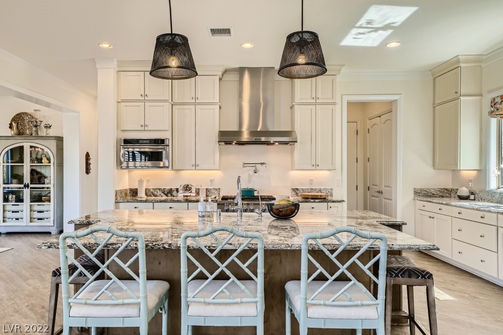 Stunning cabinetry, undermount lighting, and luxury appliances.