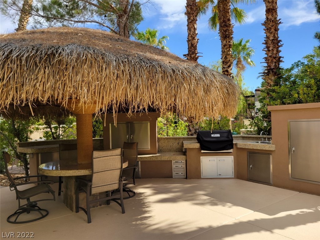 Located within the Class A Las Vegas Motorcoach Resort, this north facing interior site is a gem! Featuring a brand new oversized palapa with misting system that shades a built-in dining table, niche with TV, and kitchen with a brand-new BBQ. This site has also been upgraded with an epoxy pad and led landscape lighting. Also, conveniently located near the clubhouse and main pool.