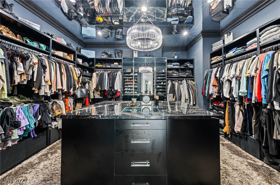 WOW! One of a kind, custom closet w/island, mirrored ceiling and chandelier