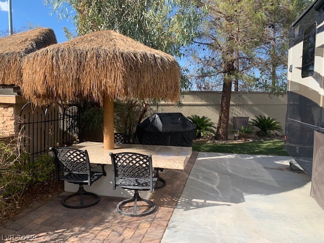 Located in the guard gated Las Vegas Motor Coach Resort, this nicely landscaped south facing lot has lots of privacy and more!  This great deal features synthetic lawn in two areas, a large shade palapa, built-in granite table, and bbq!   Will go fast!