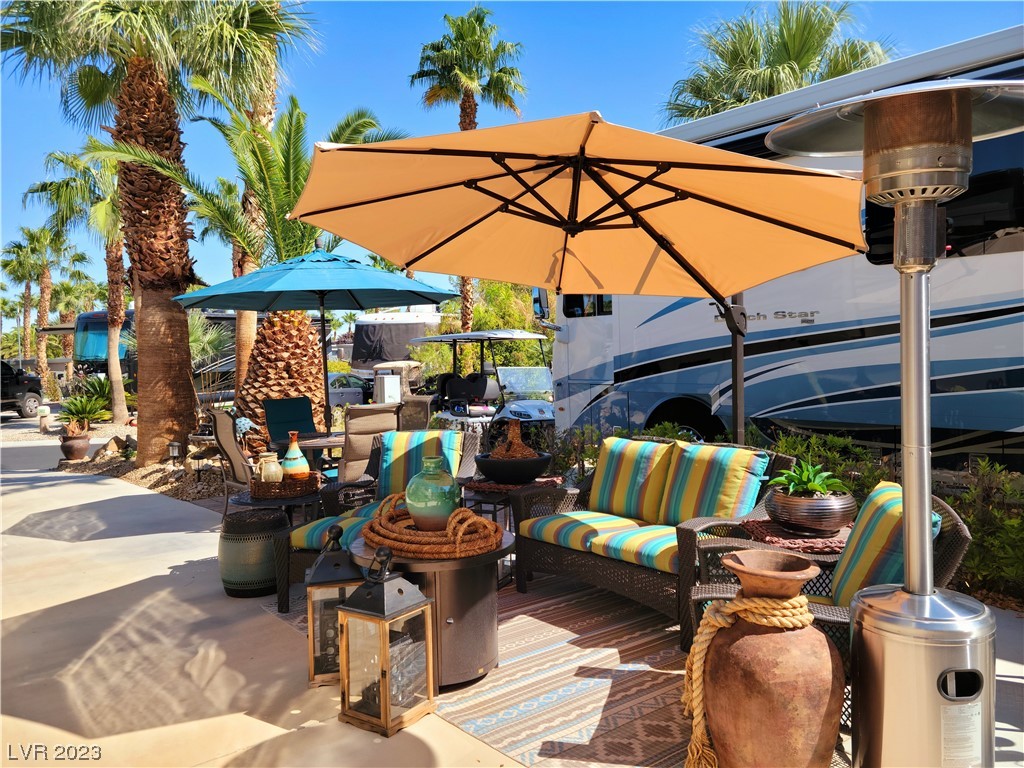 Located within the Class A Las Vegas Motorcoach Resort. What a great site! This beautiful east facing lot located on a quiet street, has been extended to create additional living space with gorgeous outdoor furniture and décor included. This site has great curb appeal with large palms and landscaping, as well as a large palapa at the back of the site that gives shade for additional seating and entertaining. A newly built stucco storage structure includes a full-size washer/dryer with plenty of storage space for all your needs. Don’t pass up this deal!