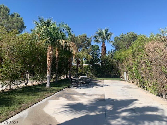 Located in the guard gated Las Vegas Motor Coach Resort, this site is shady and private!   This lushly landscaped south facing site is full of mature queen palm trees, hedges, and grass.   Ready for a future buildout if you wish, or perfect just the way it is!   Priced to go quick!