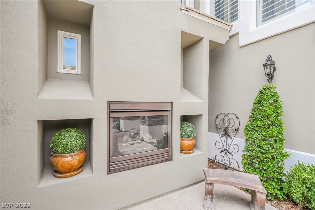 Tranquil Private Courtyard With Fireplace & Sitting Area