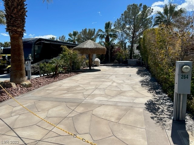 Located in the Guard Gated Las Vegas Motor Coach Resort, this site offers lots of Bang for the Buck!    This private north facing site is priced to go quick featuring a decorative concrete pad and pavers, mature landscaping, palapa, outdoor kitchen, and more.