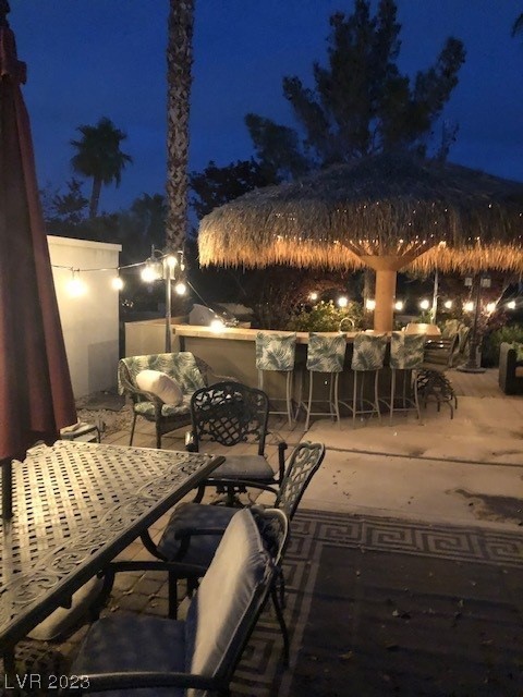 Located in the guard gated Las Vegas Motor Coach Resort, this site most certainly shows pride of ownership and offers lots of bang for the buck including a full kitchen and bar area, stainless appliances, furniture, living room area with TV & fireplace, water feature, and more!