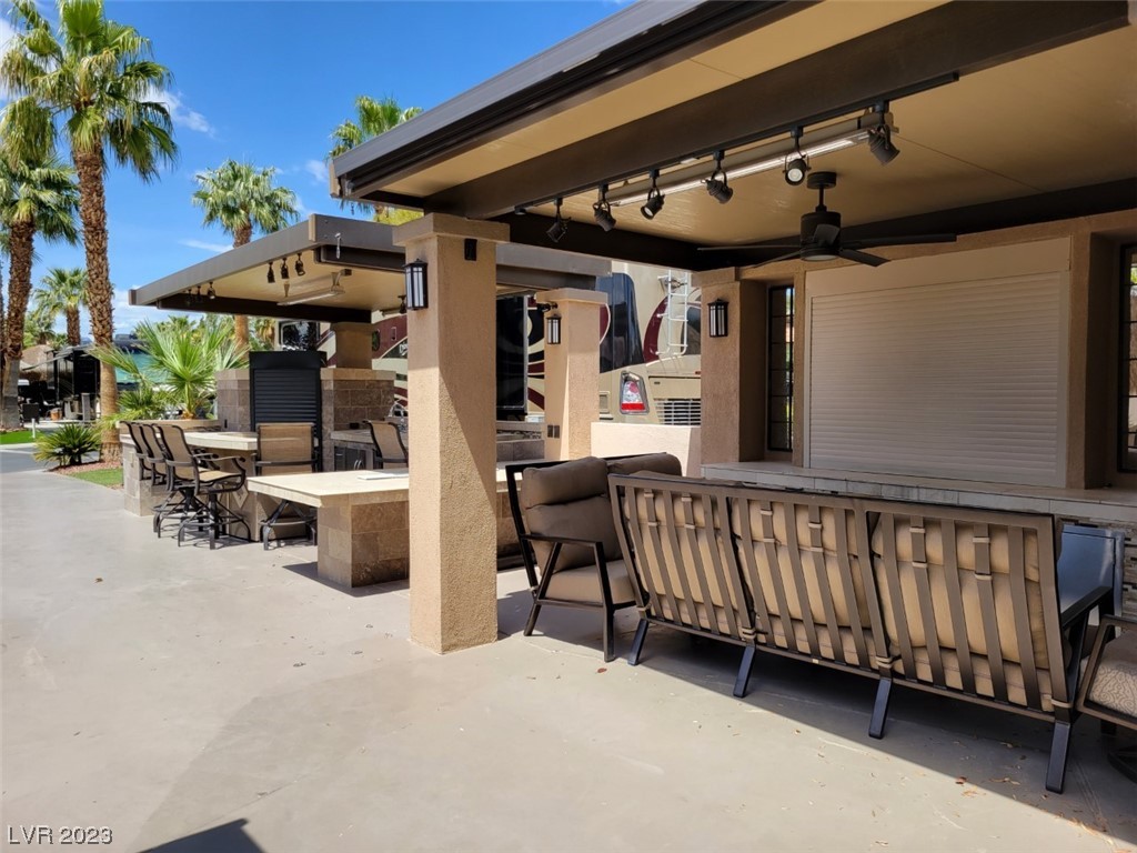 Located within the Class A Las Vegas Motorcoach Resort, this spectacular built out site has spared no expense on the stucco and tiled structures that feature a full outdoor kitchen and living area with TV & fireplace. Drop down shades, pantry, ceiling fans, ceiling heaters, travertine counters, fire table, storage area with washer/dryer, and even a comfort station are just a few of the included amenities. This site is a must see!