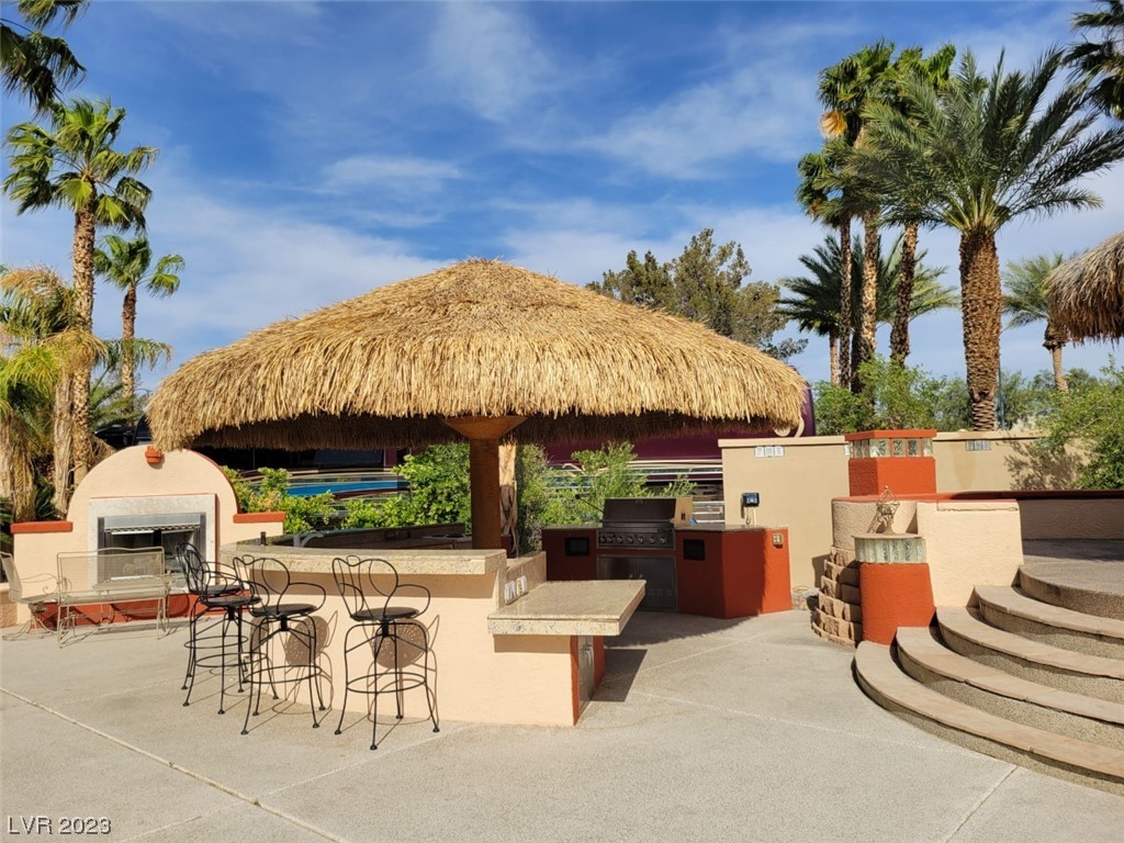 Located within the Class A Las Vegas Motorcoach Resort, this site is an “Old Town” Classic! Huge pie shaped premium site with large shade palapas, fireplace, full kitchen with bar seating, elevated dining area, storage, landscaping, and so much more!