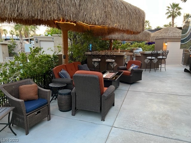 Located in the guard gated Las Vegas Motorcoach Resort, this site is immaculate and cozy!    This awesome site is super well-kept featuring shade palapas, full outdoor kitchen with granite counters, bar seating, living room area with firepit, storage, custom lighting, and much more!  This one will go quick!